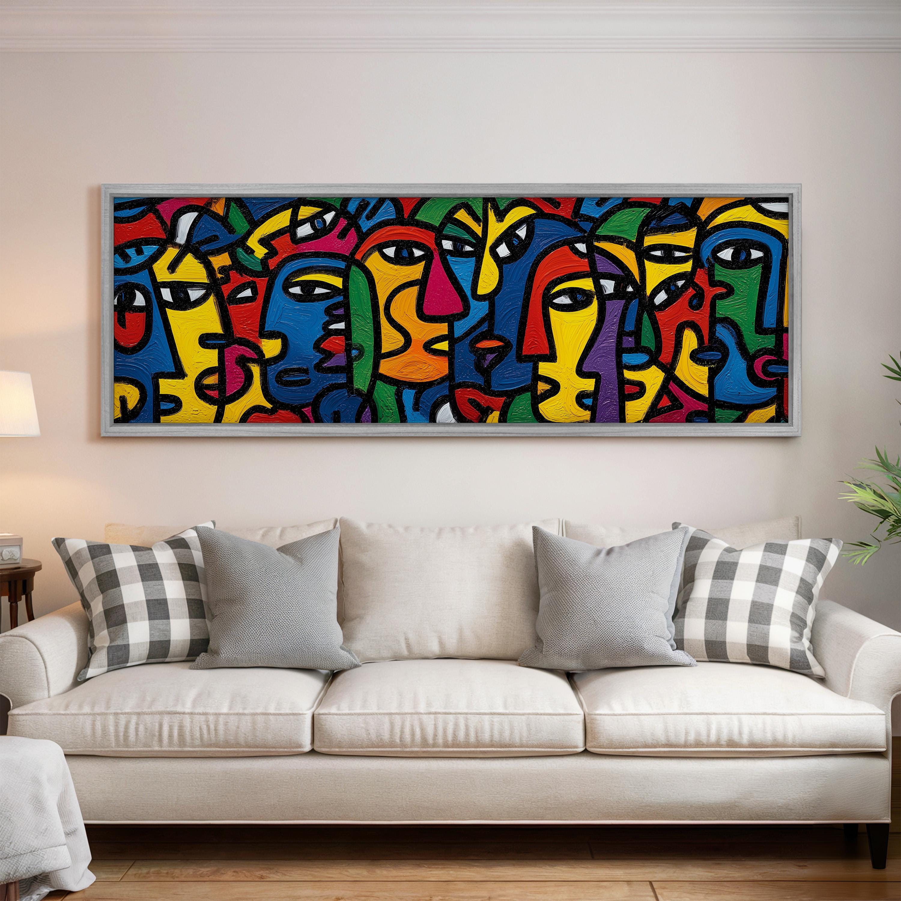 a large, colorful abstract painting hanging on a wall above a white couch in a living room.