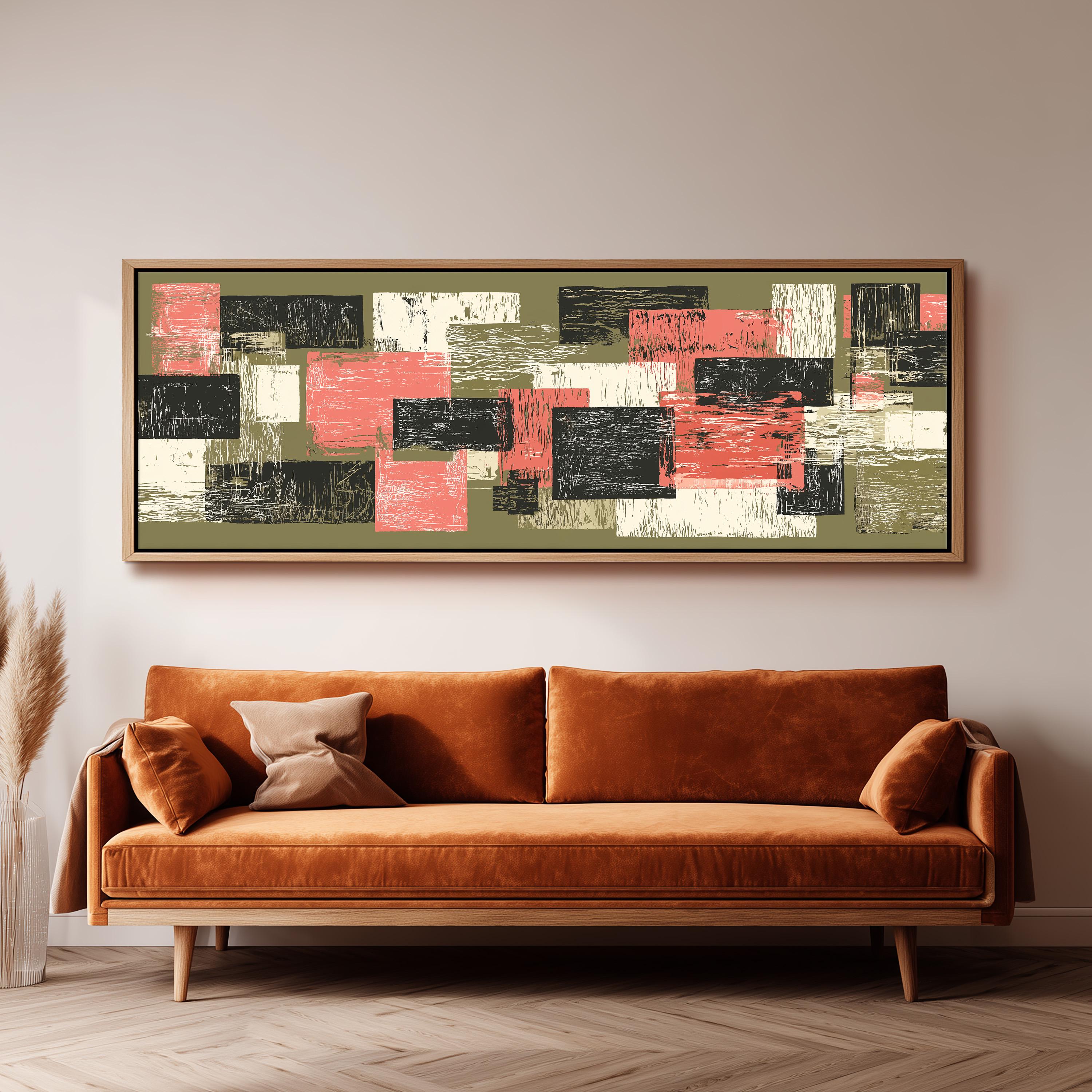 a large abstract painting hanging on a wall above a brown sofa with two pillows.