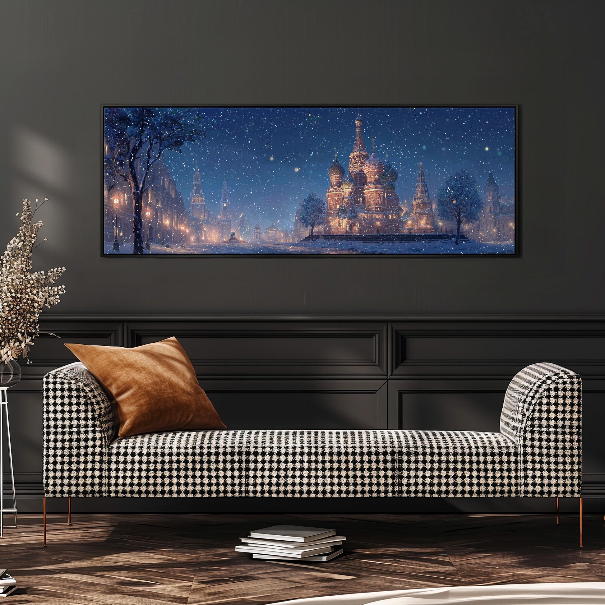 a large, framed painting of a snowy cityscape with a castle in the background, hanging on a wall above a black and white checkered sofa.