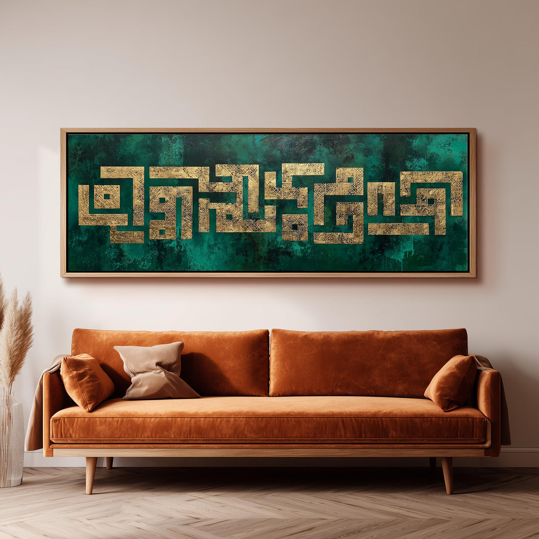 a large, framed artwork hanging on a wall above a brown sofa.