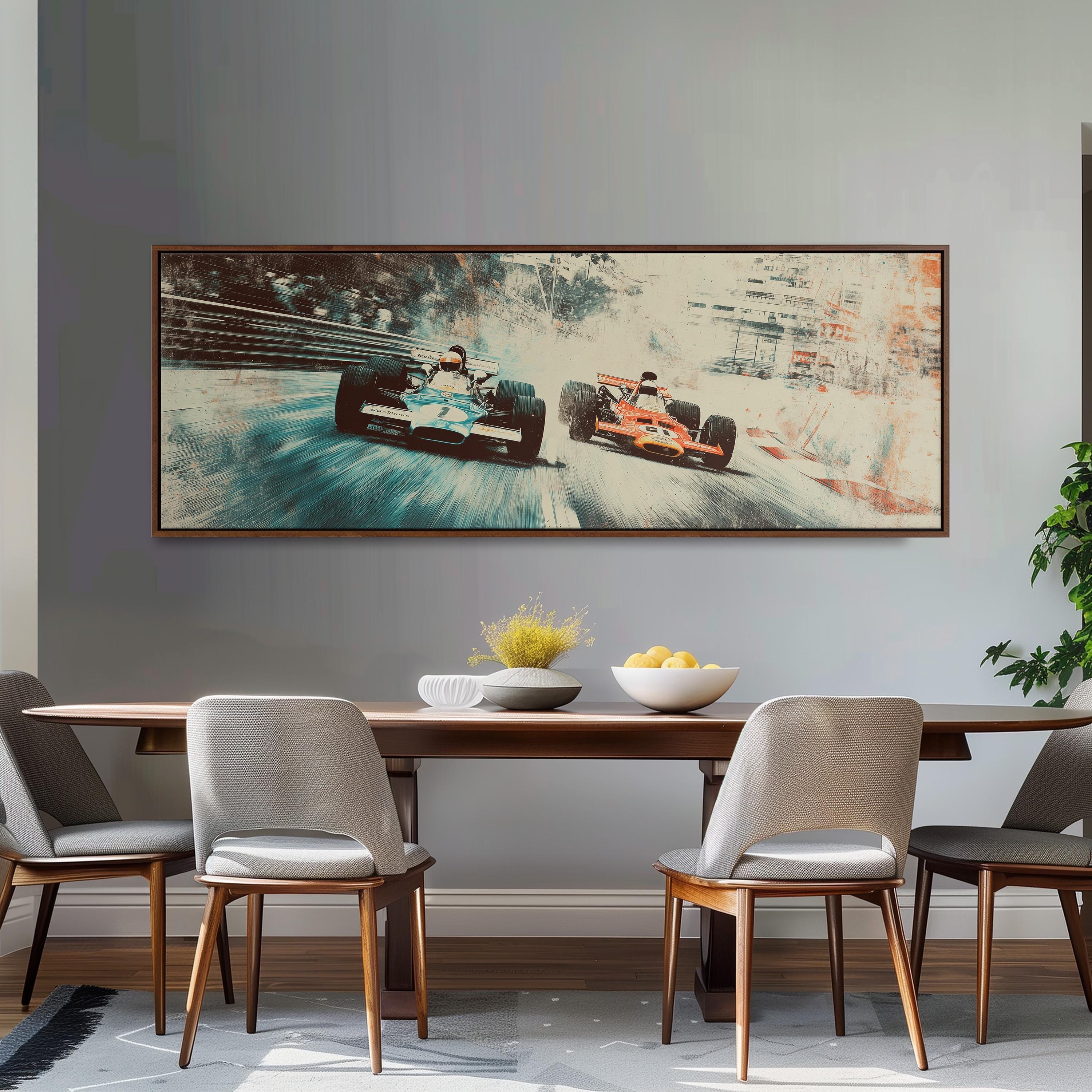 a large framed painting of two Formula One race cars speeding down a track, with a dining table and chairs in the foreground.