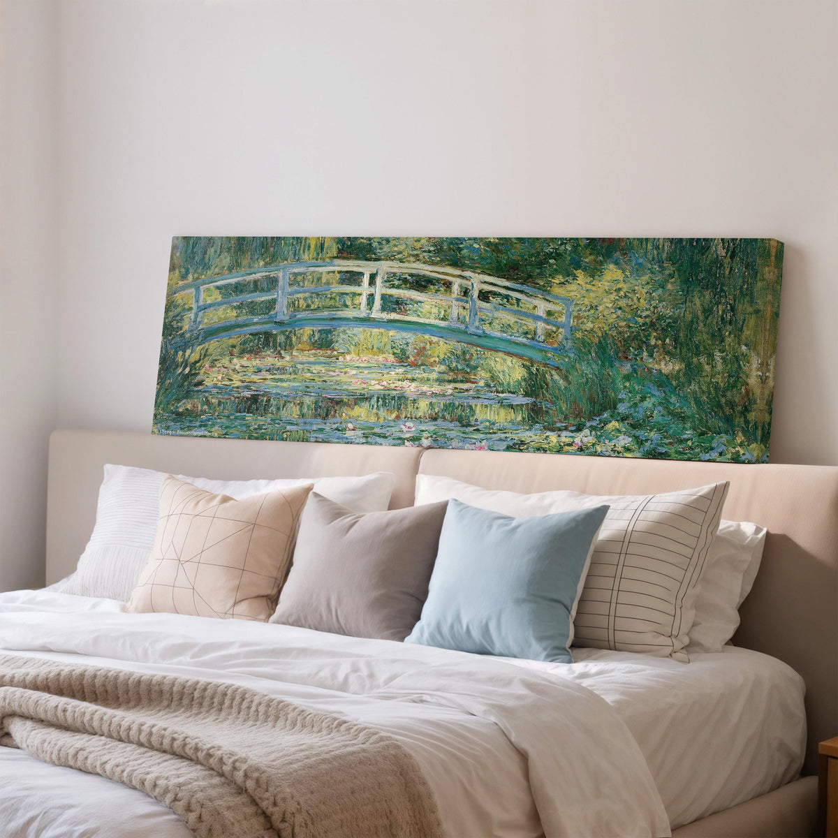 Japanese bridge over a water lily pond wide panoramic canvas print above a bed in a bedroom