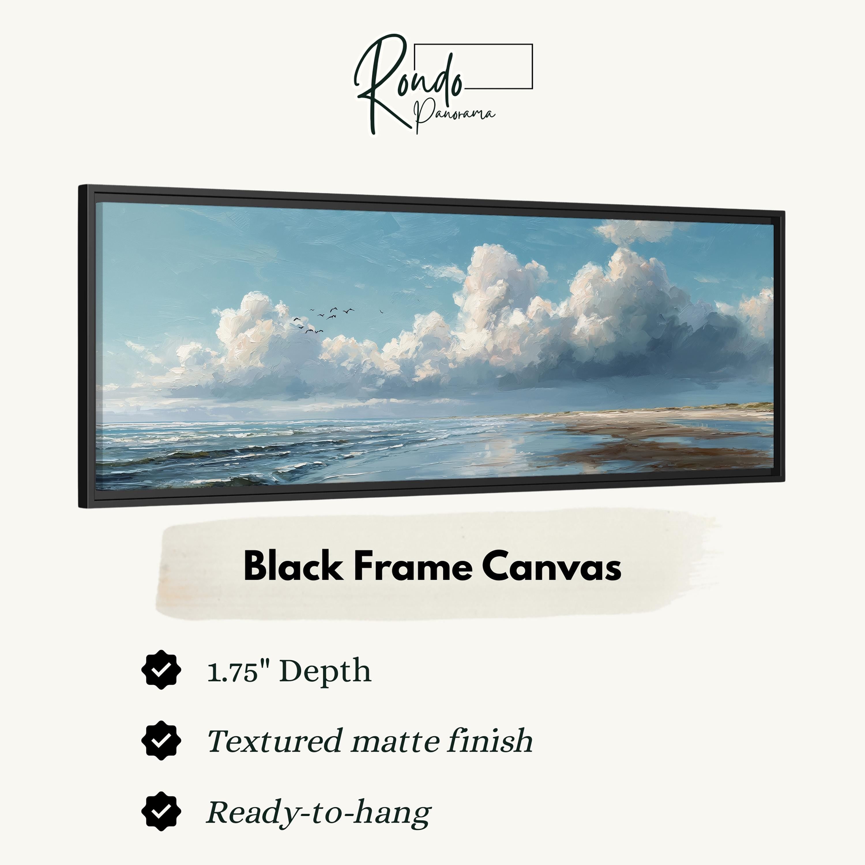 The image is a black frame canvas depicting a serene landscape with a blue sky, fluffy white clouds, and a calm ocean.