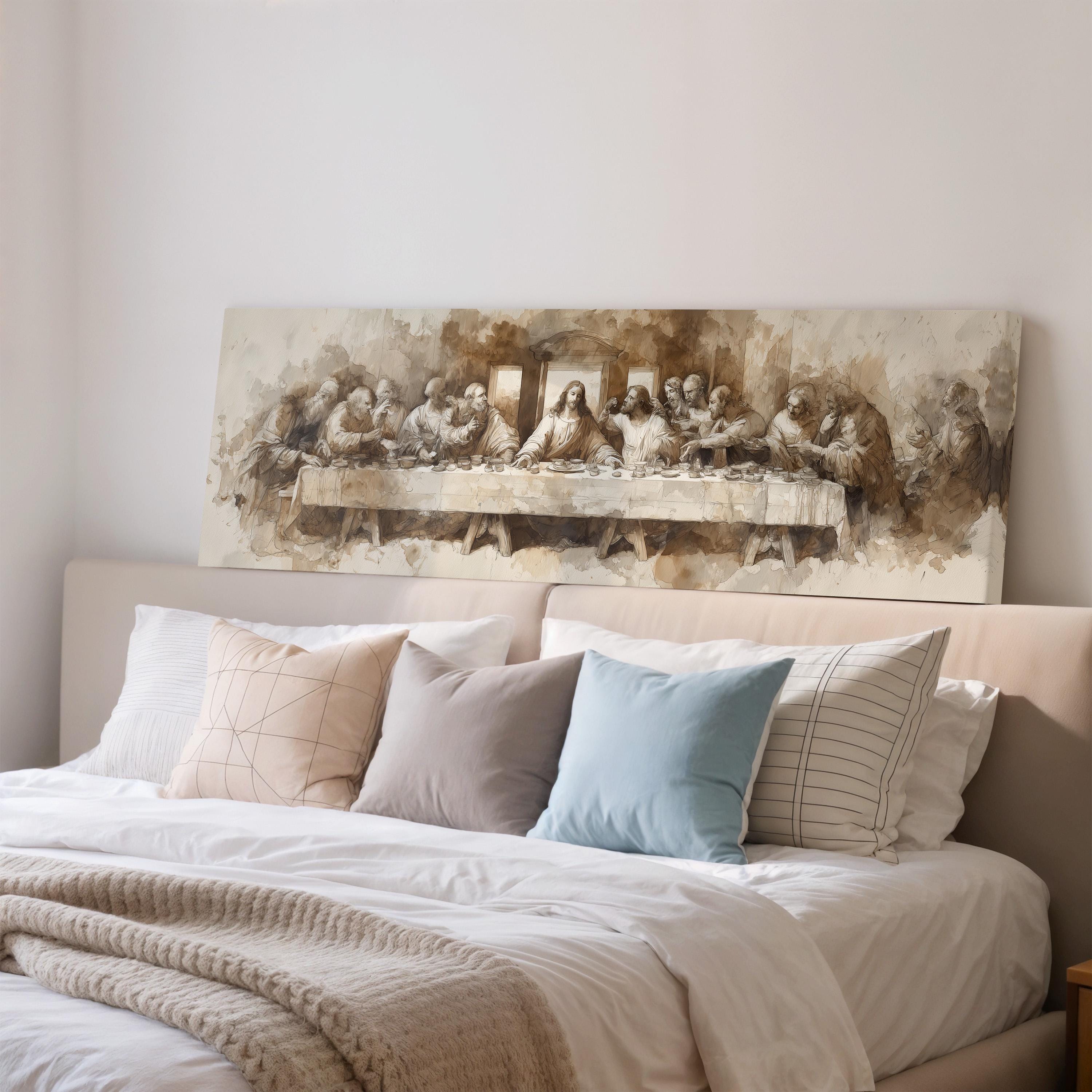 a large painting of the Last Supper hanging on a wall above a bed with pillows.