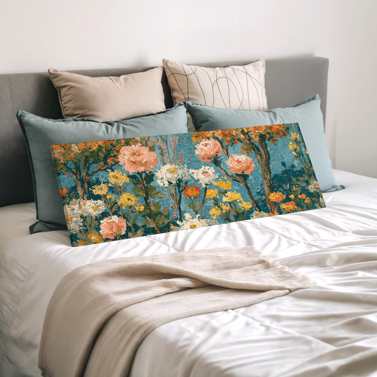 Pink blossom garden pattern wide panoramic canvas print laid on a bed to show its size