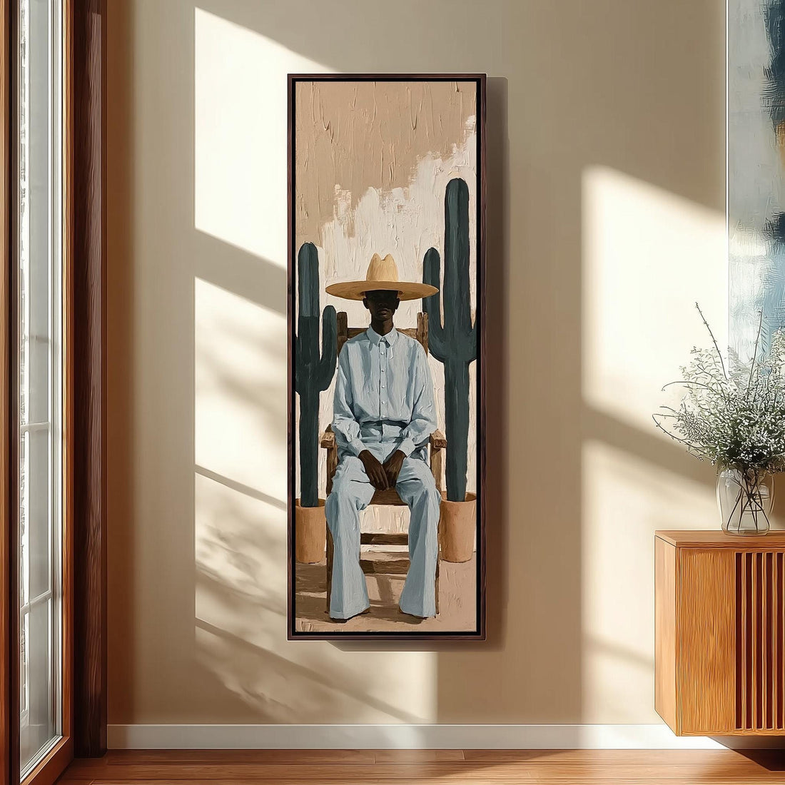 Cowboy seated between two cacti long vertical canvas print in a sunlit living space