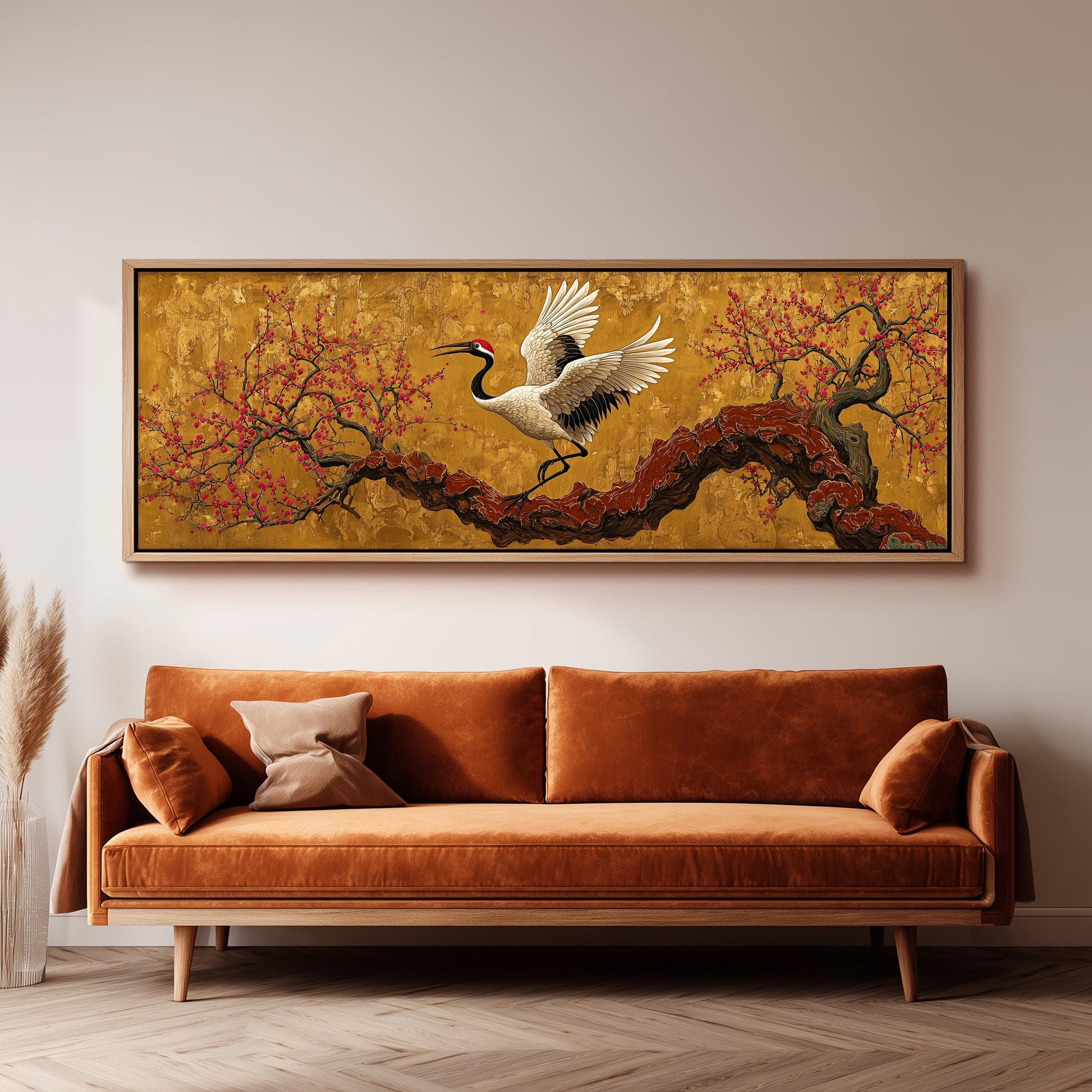 a large, framed painting of a crane in flight above a brown sofa in a living room setting.