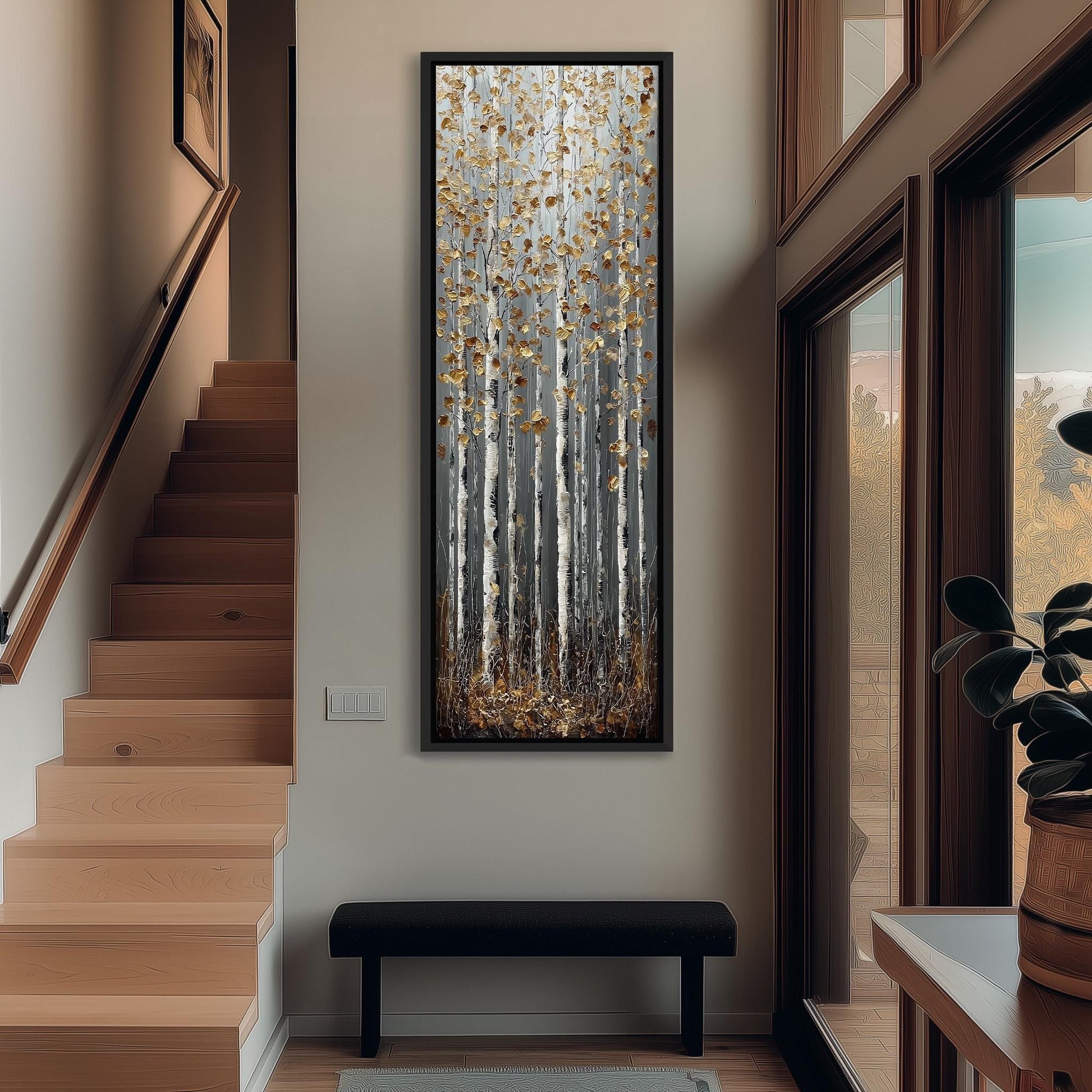 a hallway with a large painting of birch trees hanging on the wall, a wooden staircase, a black bench, and a plant in a pot.