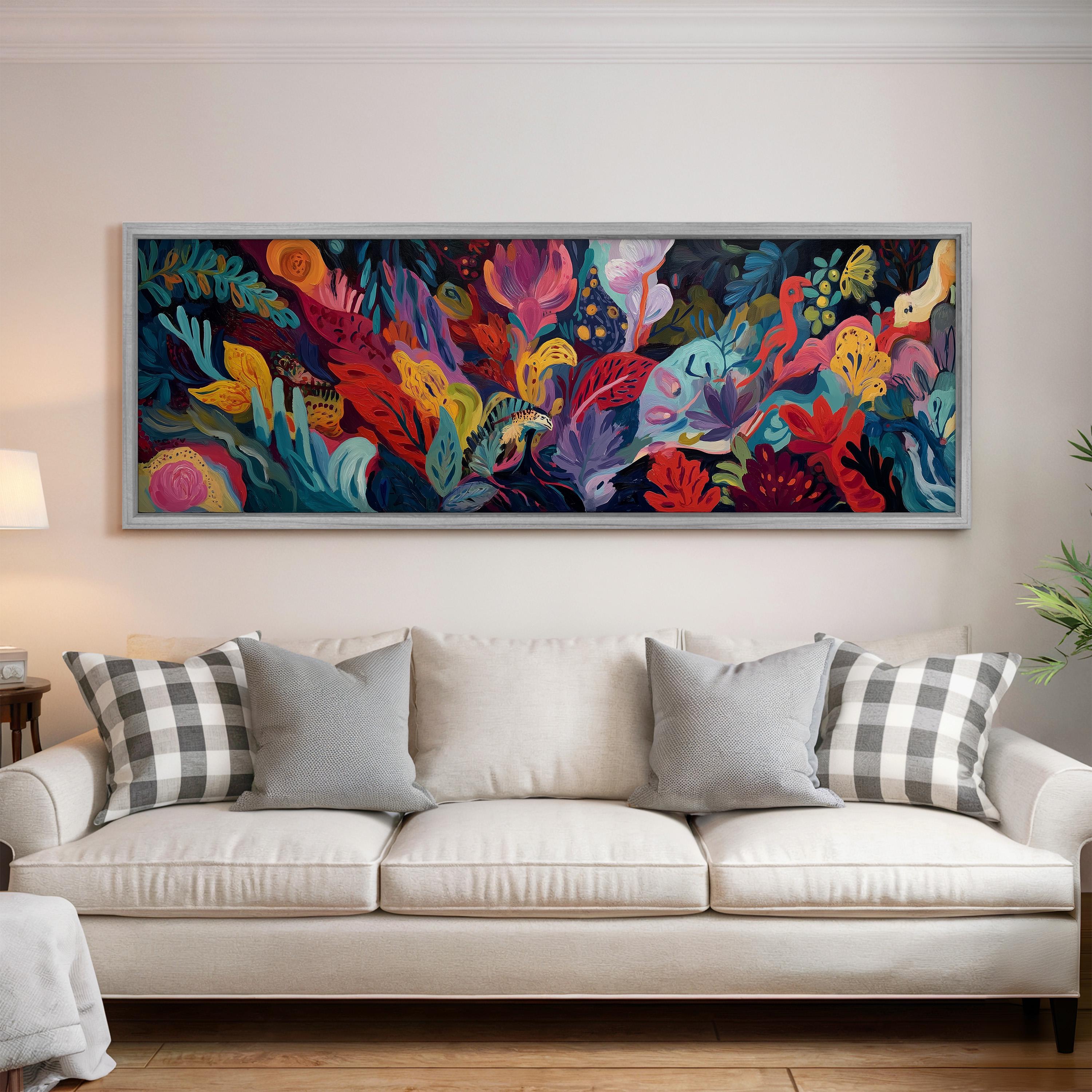 a large, colorful painting of a vibrant underwater scene hanging on a wall above a white couch with gray and white plaid throw pillows.