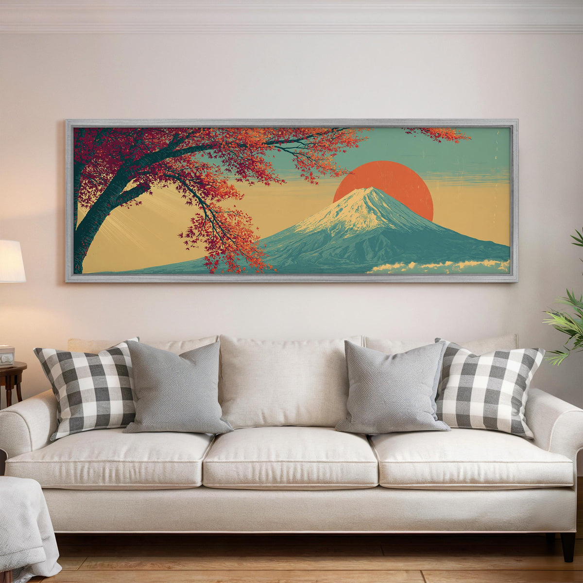 Autumn maple branch and Mount Fuji at sunset panoramic canvas print above a white sofa in a bright living room
