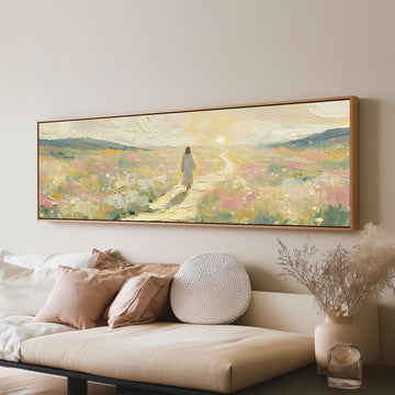 Jesus walking a pastel meadow path long horizontal canvas print above a sofa in a living room