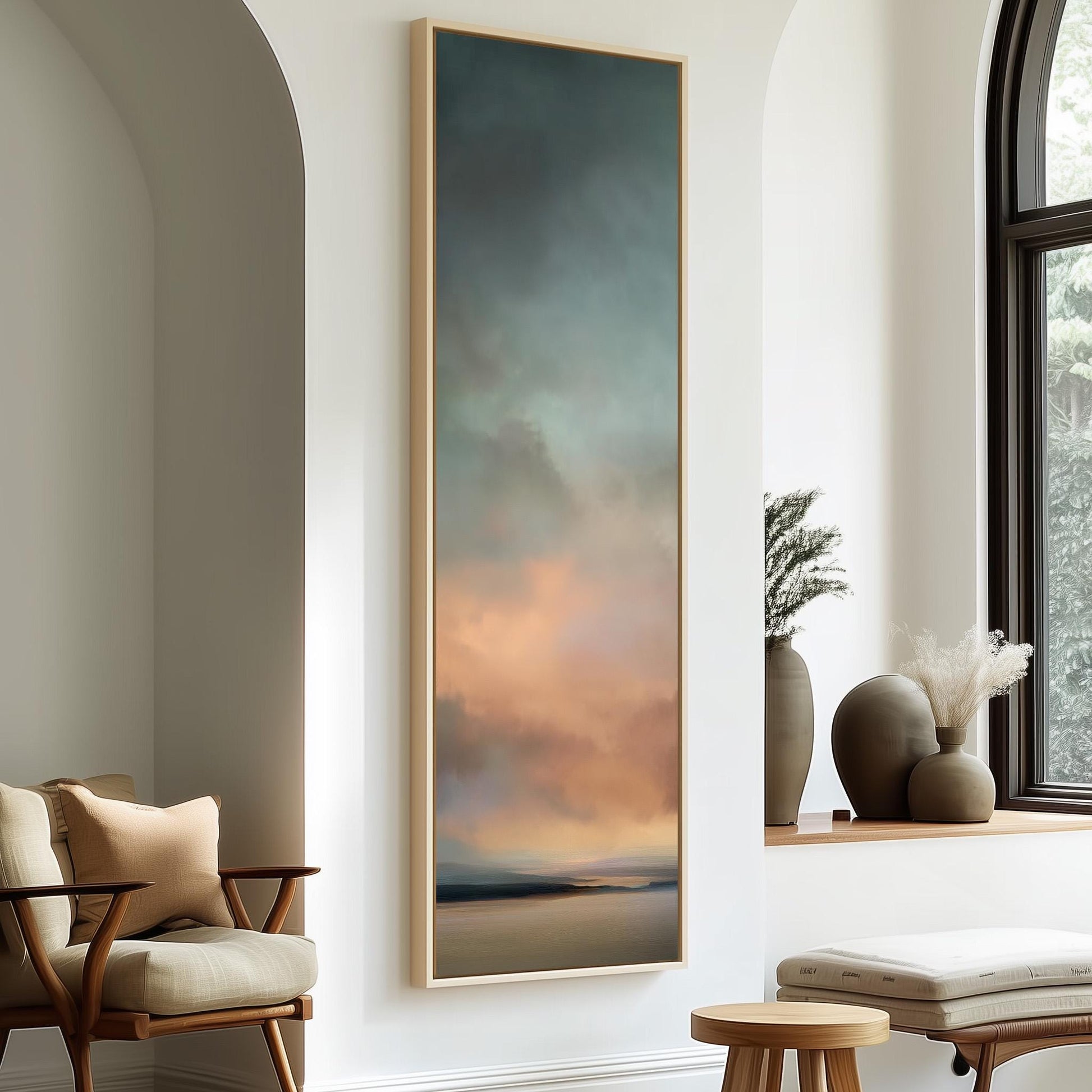 a large painting hanging on a white wall, with a wooden chair and a small table in the foreground.