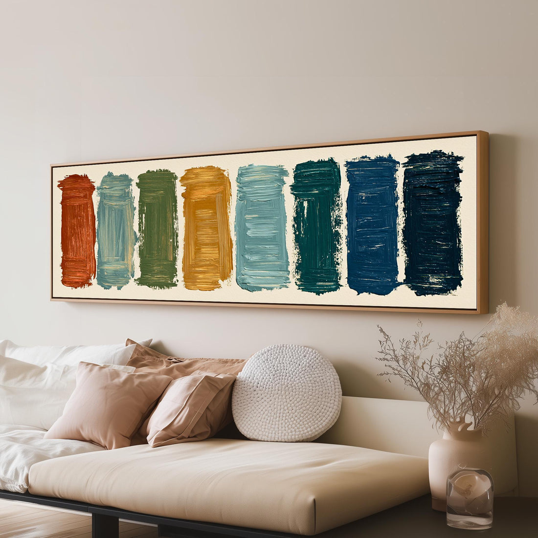 Bold brushstroke color swatches long horizontal canvas print above a sofa in a living room
