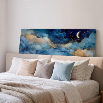 a large bedroom with a bed adorned with white pillows and a blue and gold abstract painting hanging above it.