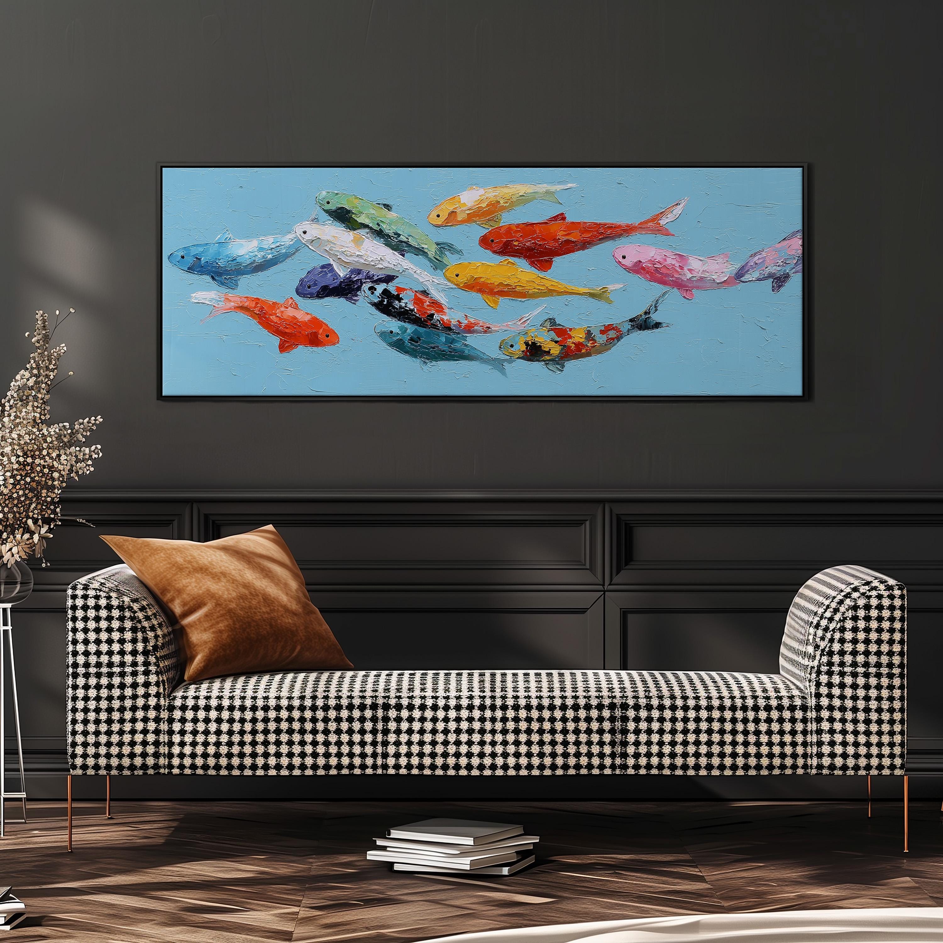 a large painting of colorful fish swimming in a blue background, hanging on a wall above a black and white checkered sofa.
