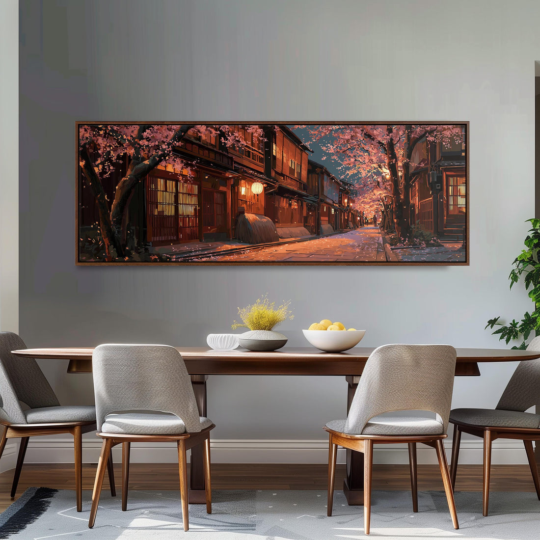 a large, framed painting of a serene street scene with cherry blossoms and traditional Japanese architecture, hanging on a wall above a brown sofa.