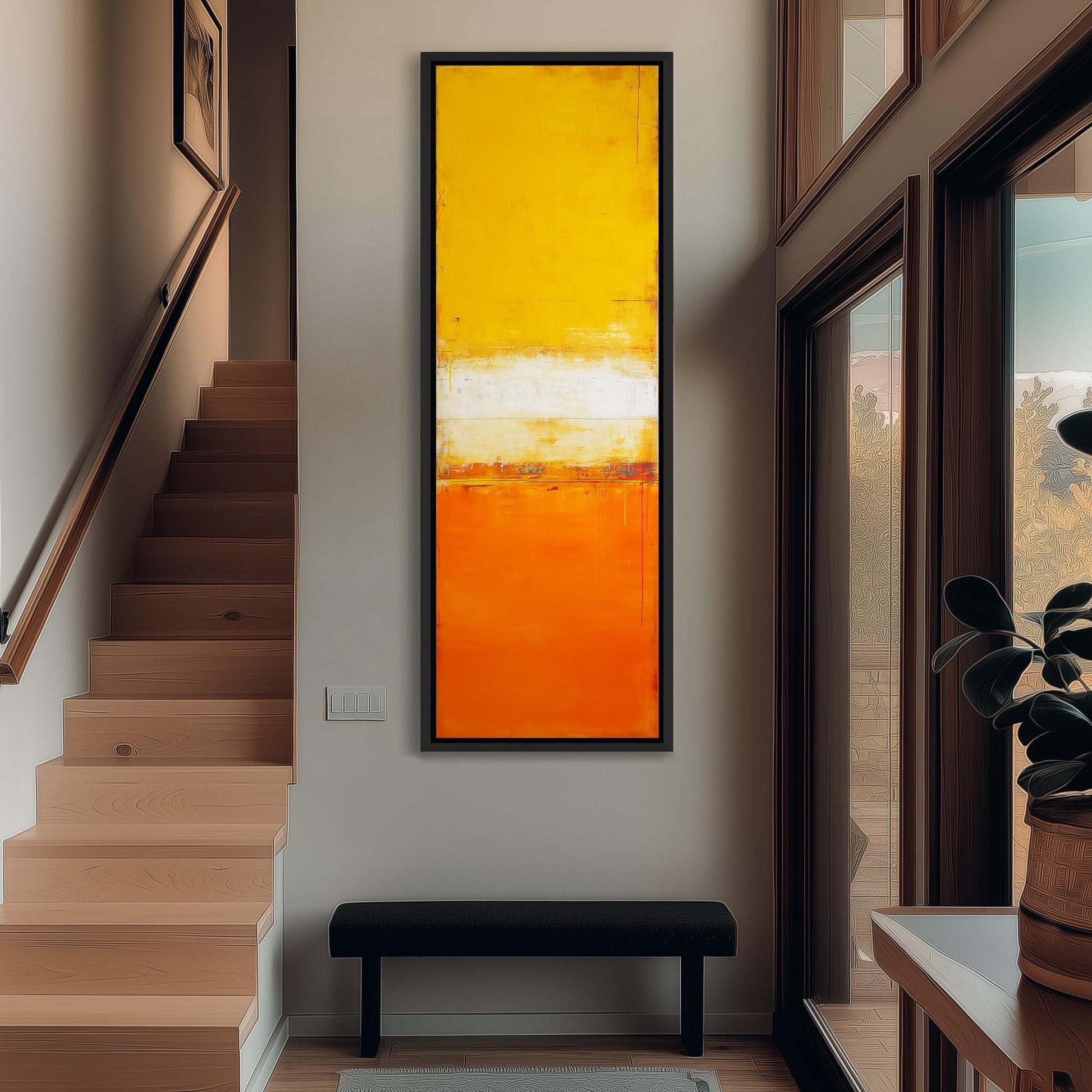 a modern interior design with a large, vibrant orange abstract painting hanging on the wall above a black bench. The painting is framed in black and is the focal point of the room. The room also includes a staircase, a window, and a plant, creating a balanced and visually appealing space.