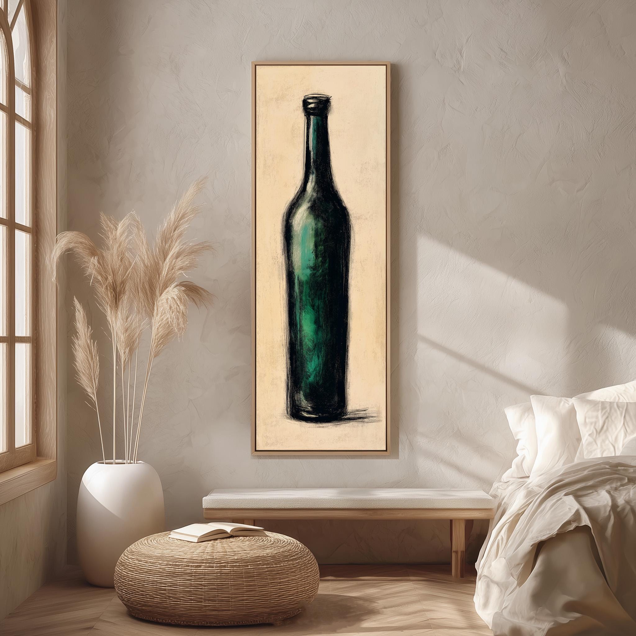 a large framed painting of a green bottle hanging on a wall in a room with a bed, a potted plant, and a woven ottoman.