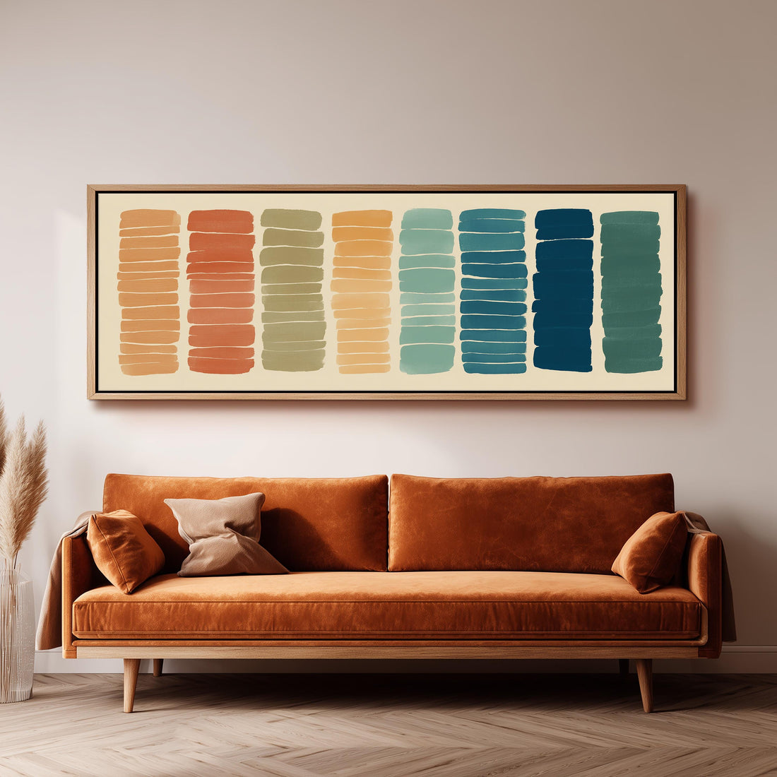 a large, rectangular, abstract painting hanging on a wall above a brown sofa.