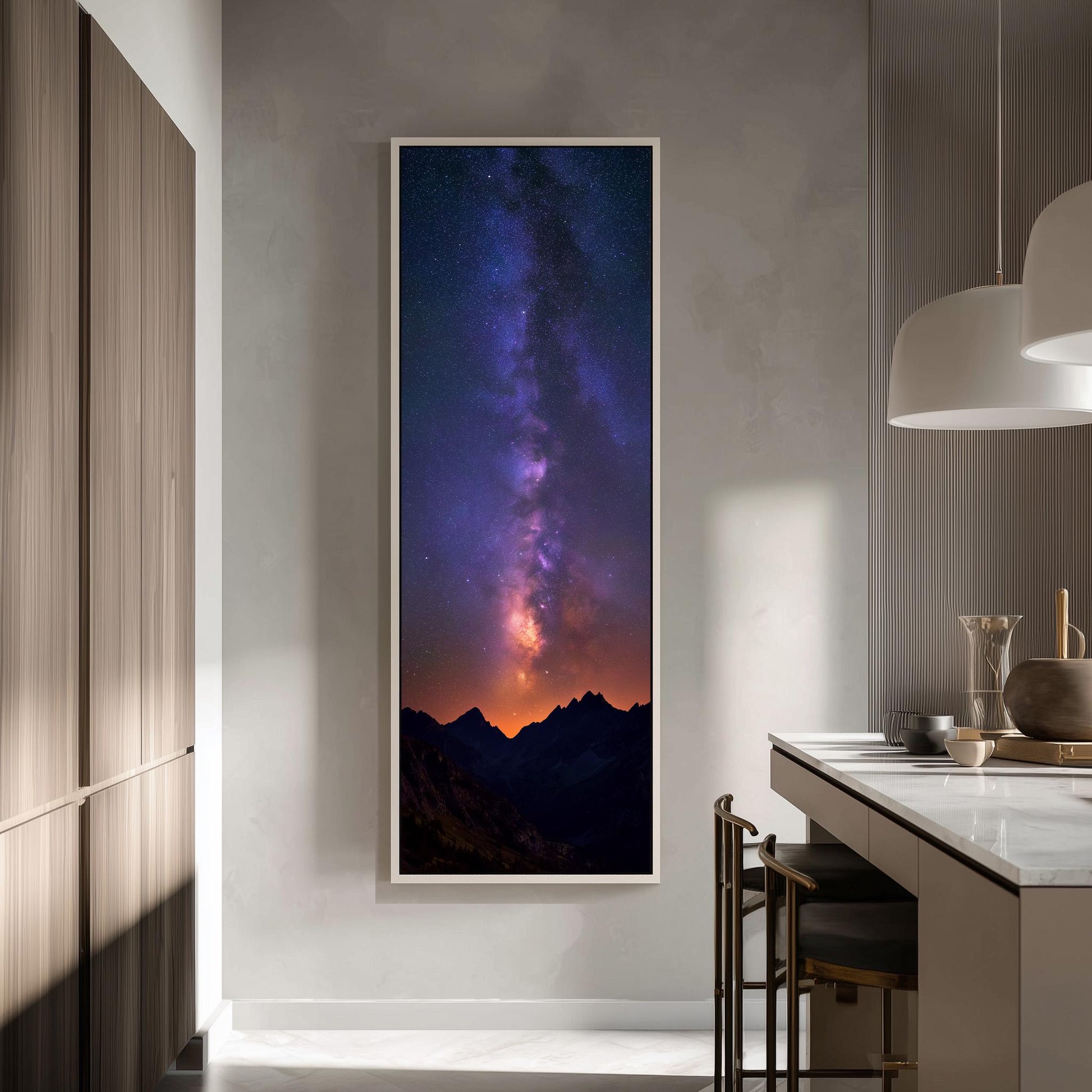 a large framed picture of a night sky with a stunning view of the Milky Way galaxy, hanging on a wall in a modern kitchen.