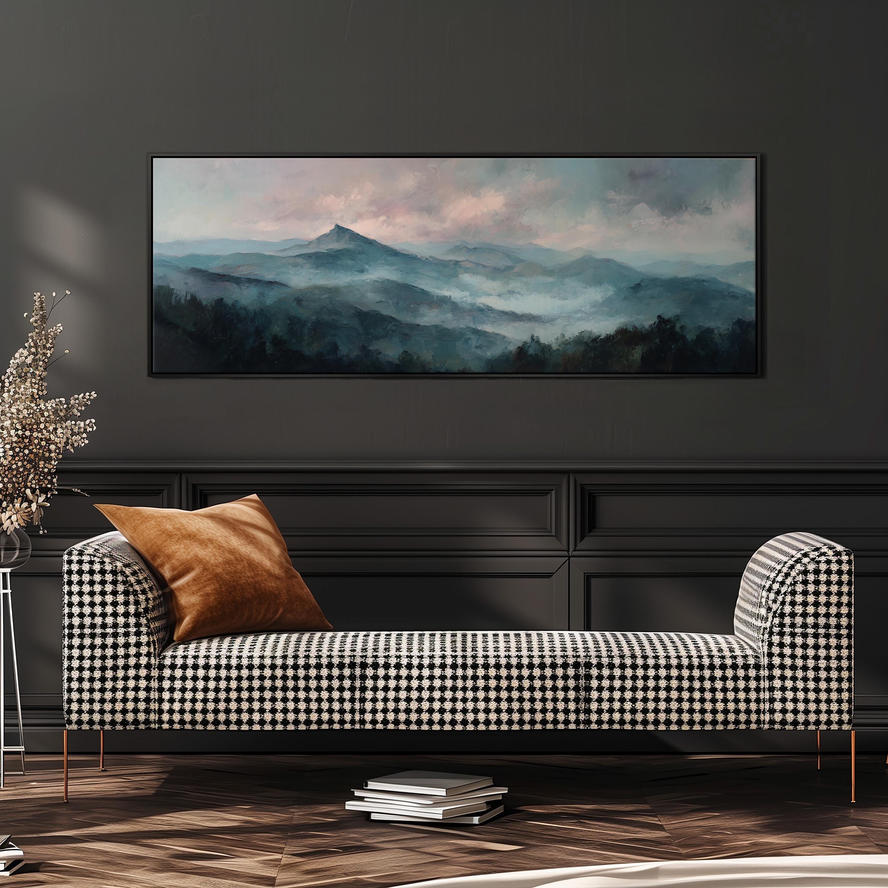 a large, framed landscape painting hanging on a dark wall above a black and white checkered sofa with a brown throw pillow.