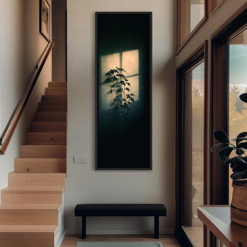 Plant silhouette in a beam of window light long vertical canvas print in a sunlit living space
