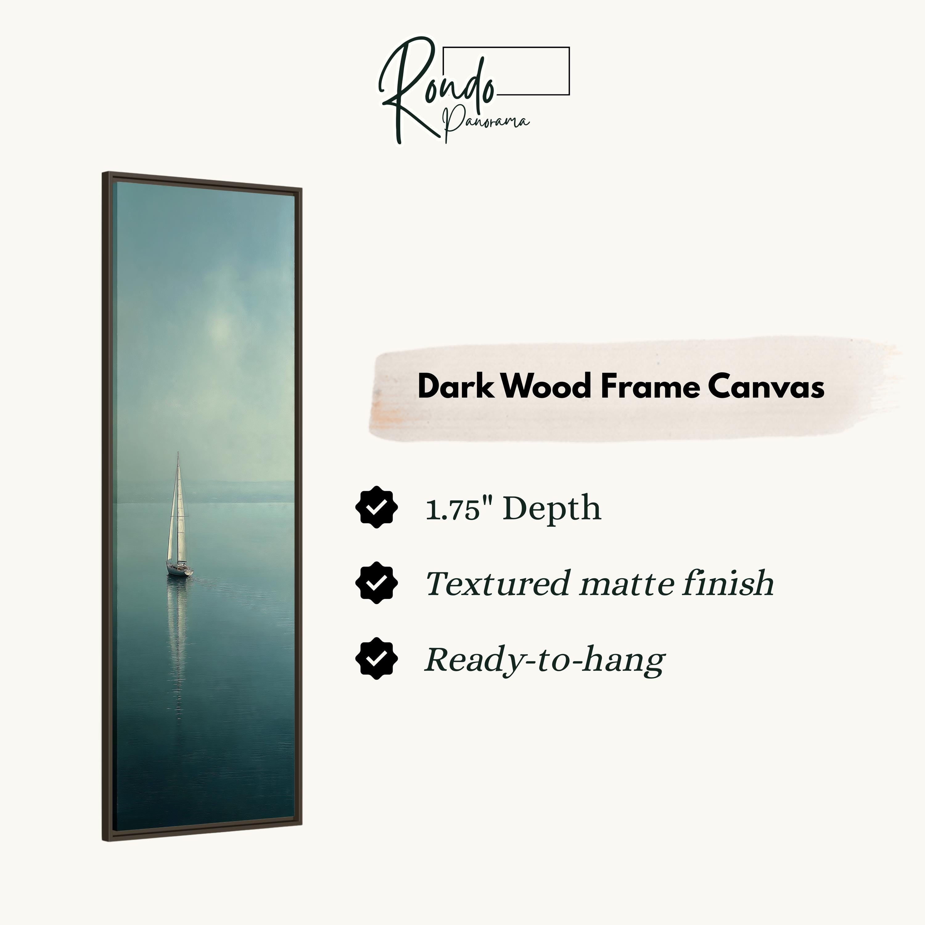a dark wood frame canvas depicting a serene scene of a sailboat on the water.