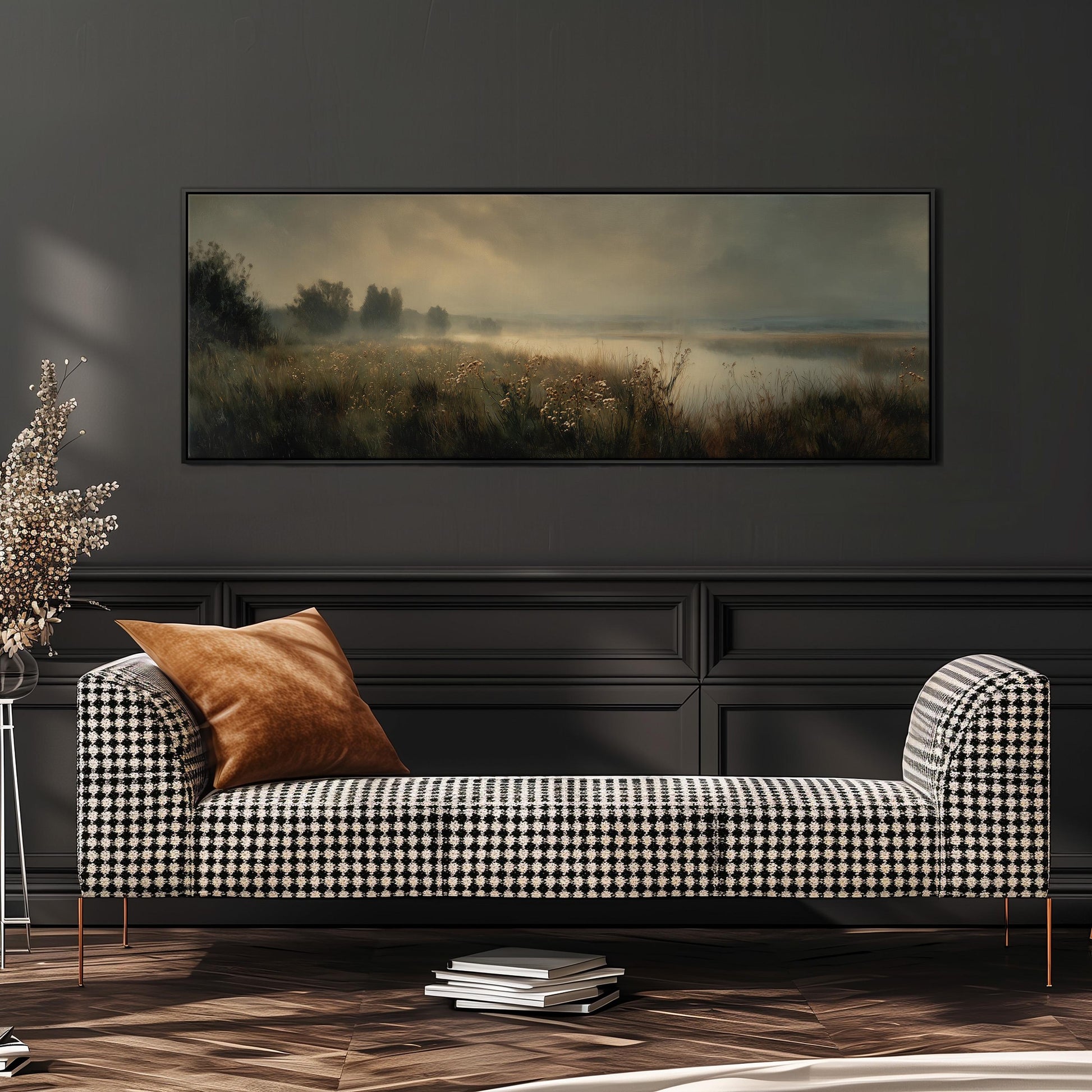 a black and white checkered sofa with a brown throw pillow, set against a dark wall with a large landscape painting hanging above it.