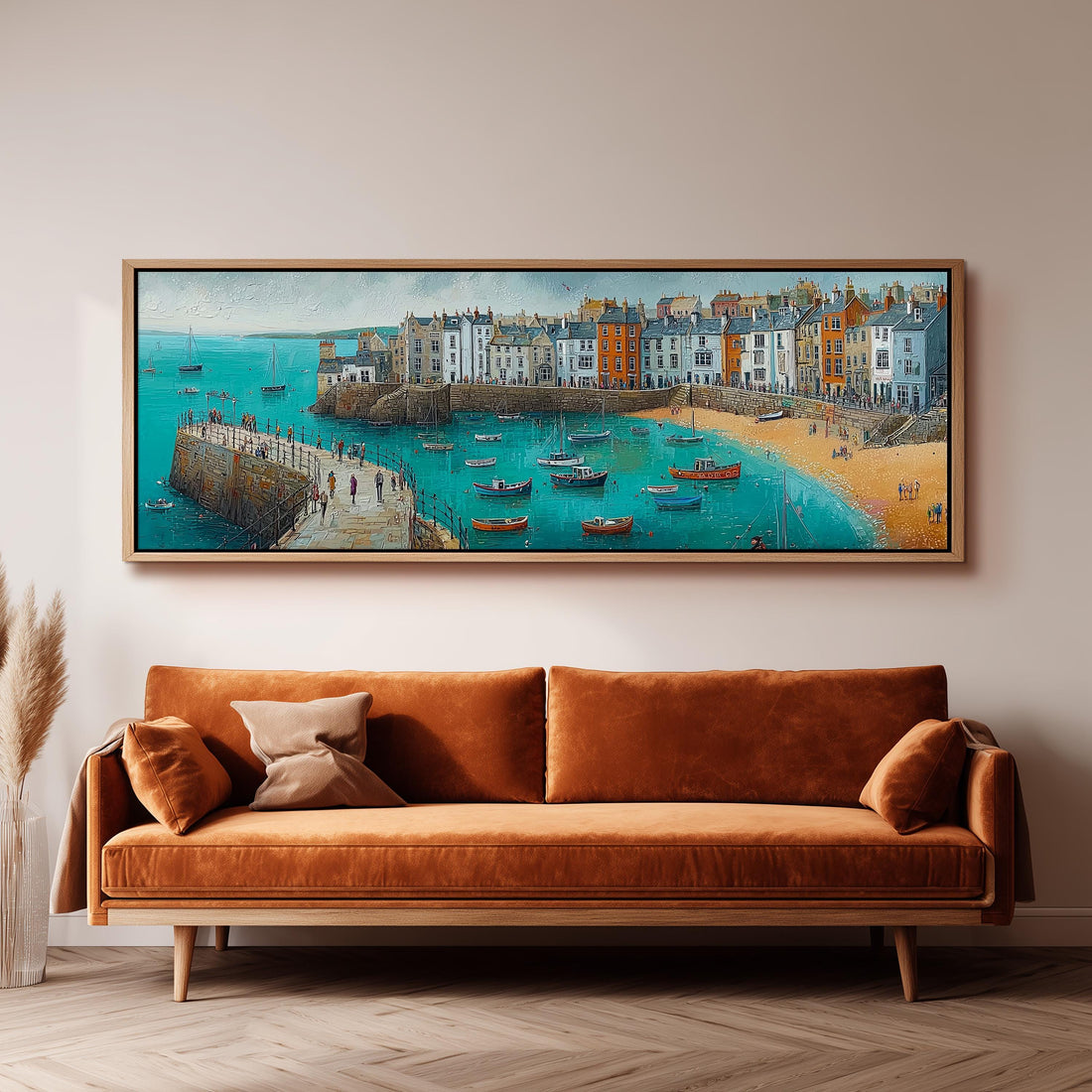 a large painting of a coastal town with boats in the water, hanging on a wall above a brown sofa.