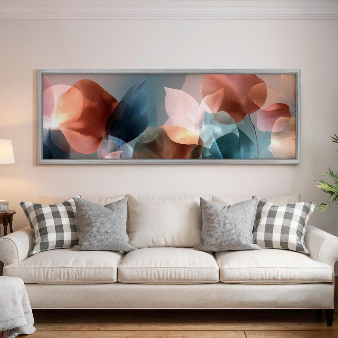 a large abstract painting hanging above a bed with white pillows and a gray blanket.