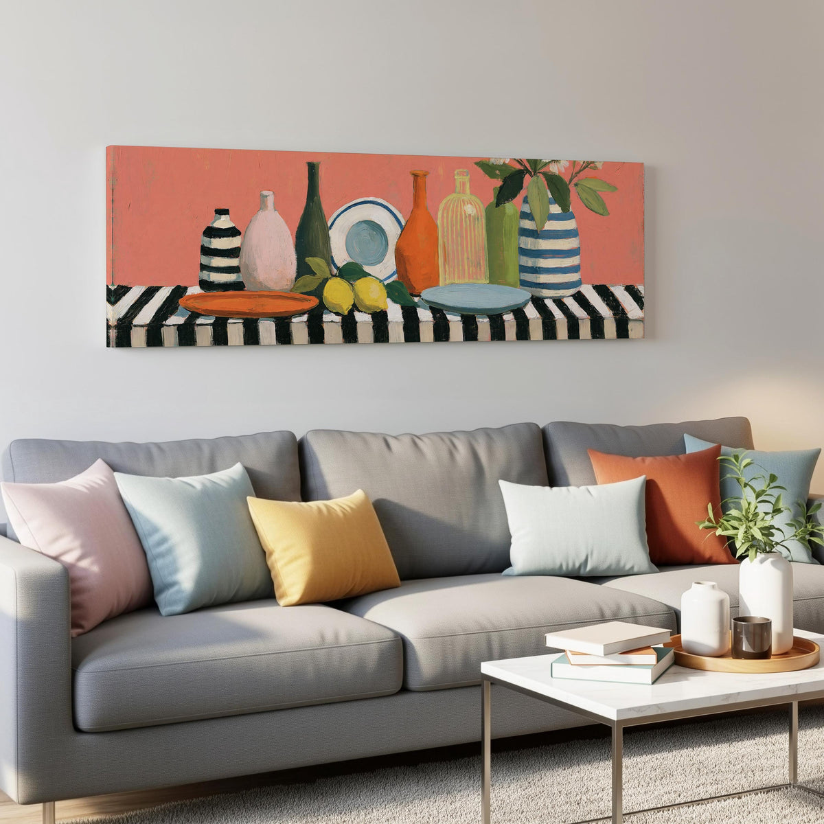 Bottles and lemons still life panoramic canvas print above a grey sofa in a living room