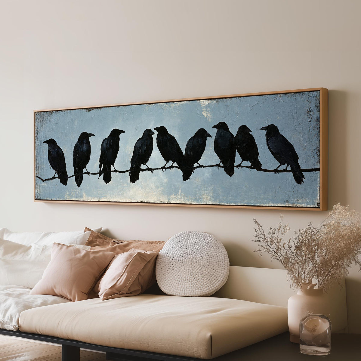 Crows gathered on a branch panoramic canvas print above a sofa in a living room