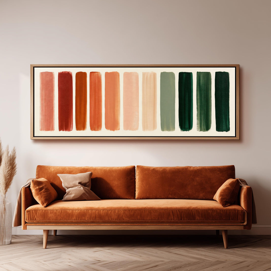 Brushed swatches from terracotta to forest green long horizontal canvas print above a sofa in a living room