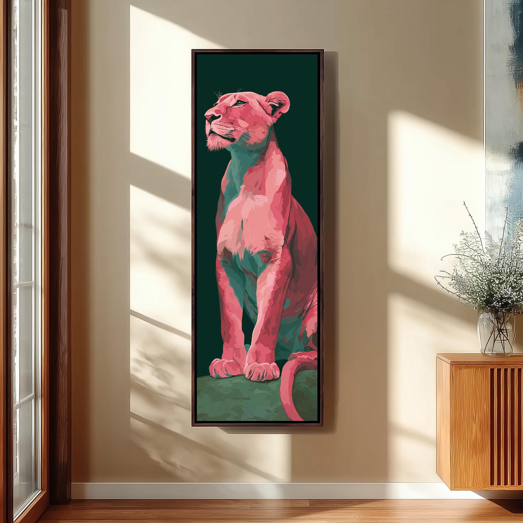 a large, vibrant painting of a pink lion on a green background, hanging on a wall in a room with a wooden cabinet and a vase of flowers.