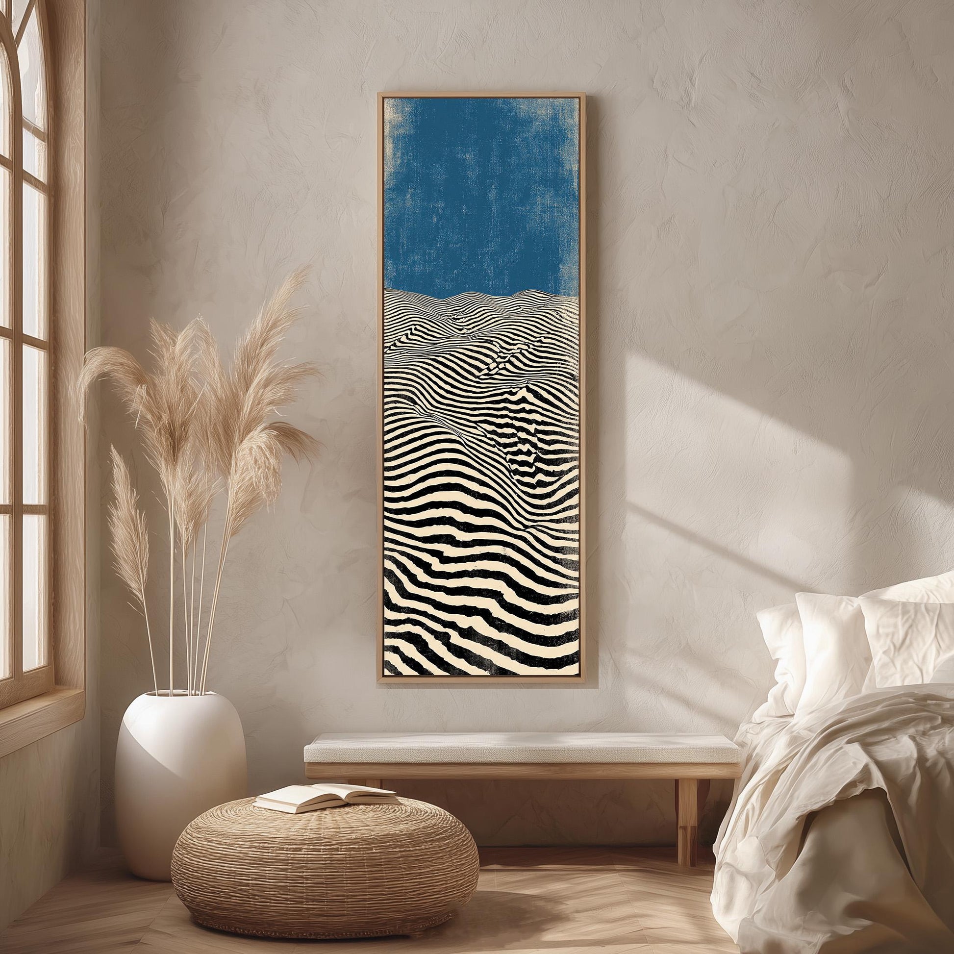 a minimalist bedroom setting with a large abstract painting hanging on the wall, a white bed with a white pillow, a white ottoman, and a window with a plant on the sill.