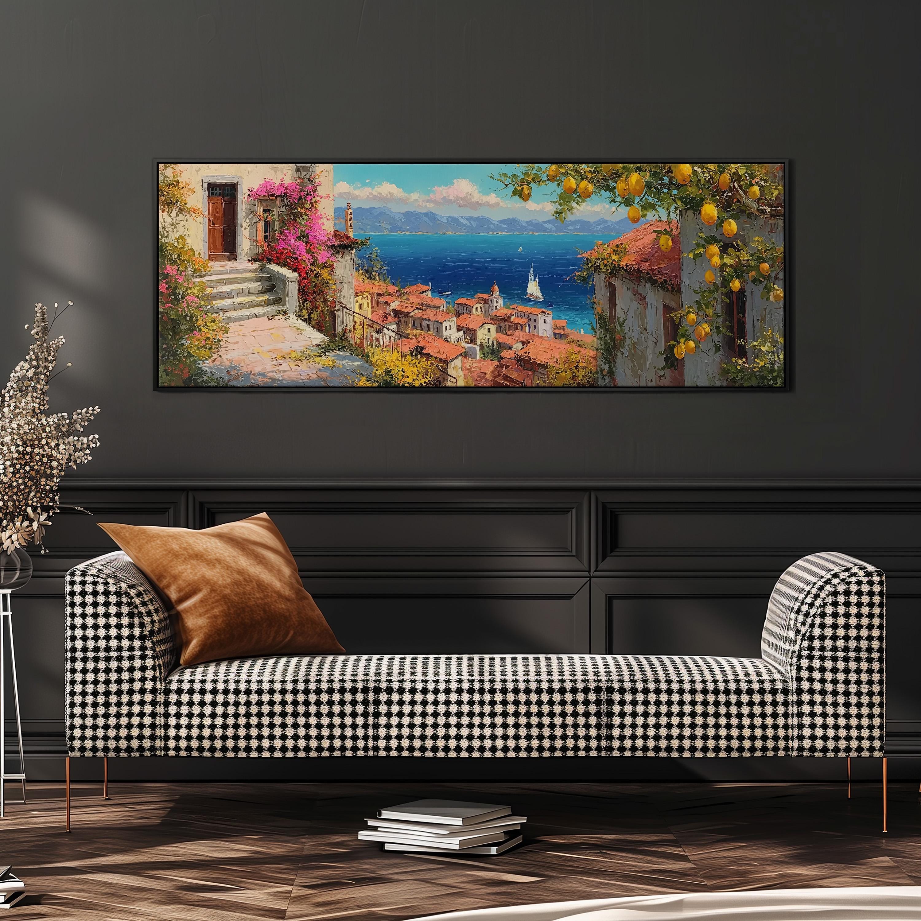 a large, colorful painting of a coastal town with a view of the ocean, hanging on a wall above a black and white checkered sofa.
