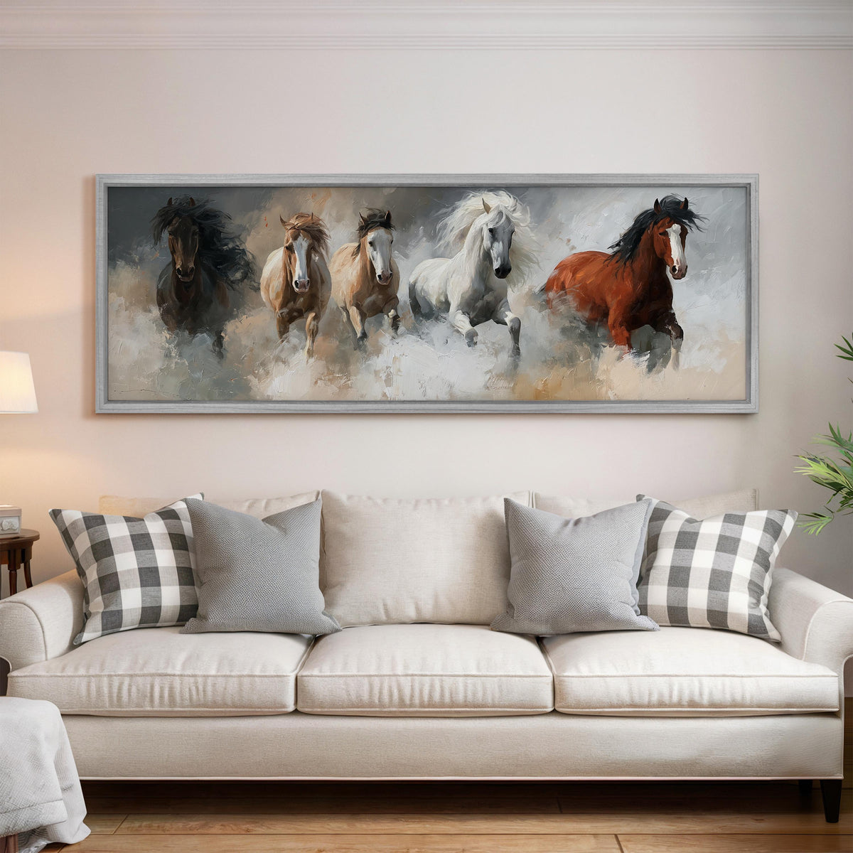 Five horses running through smoke panoramic canvas print above a white sofa in a bright living room