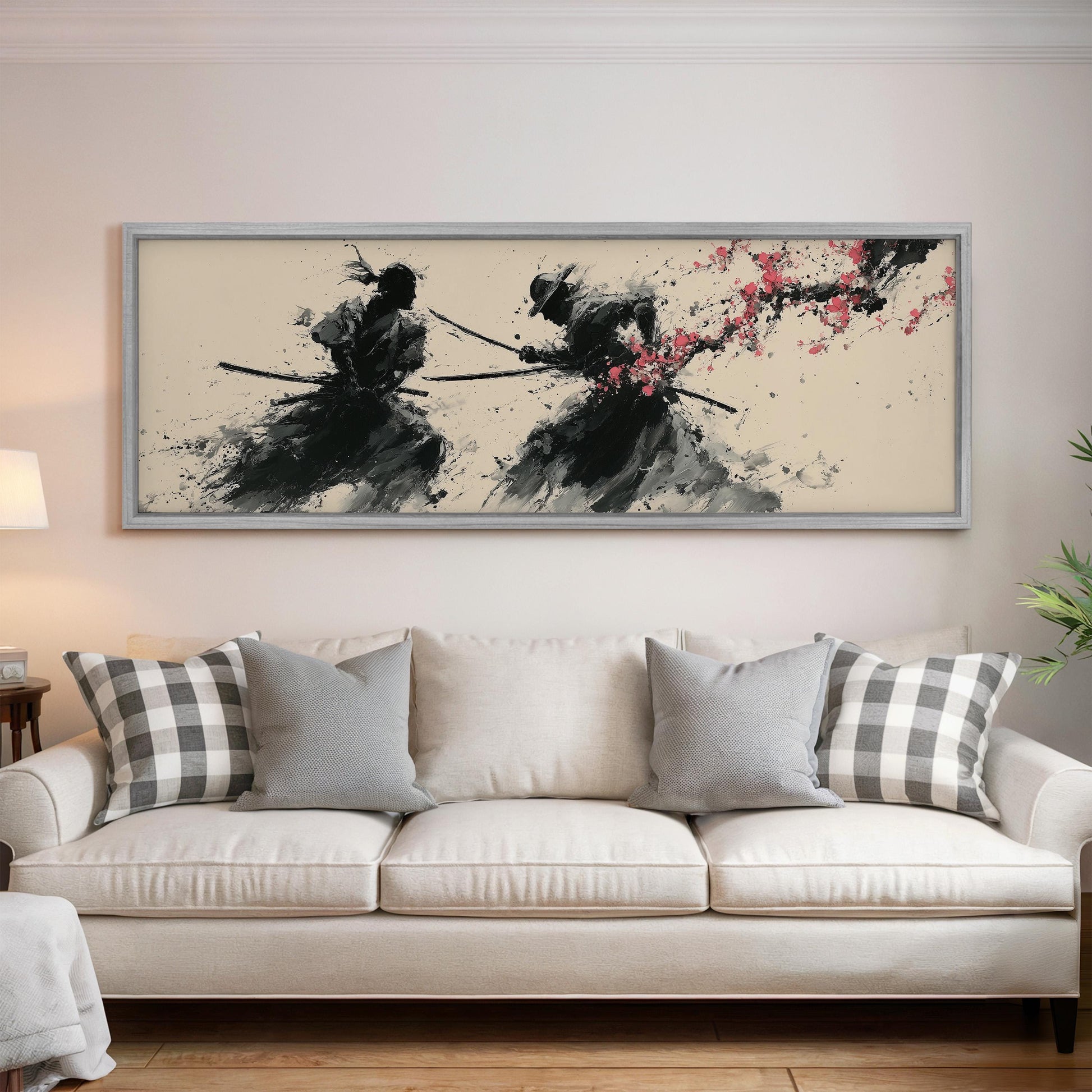 a large framed artwork depicting two figures wielding swords, with a floral design in the background.