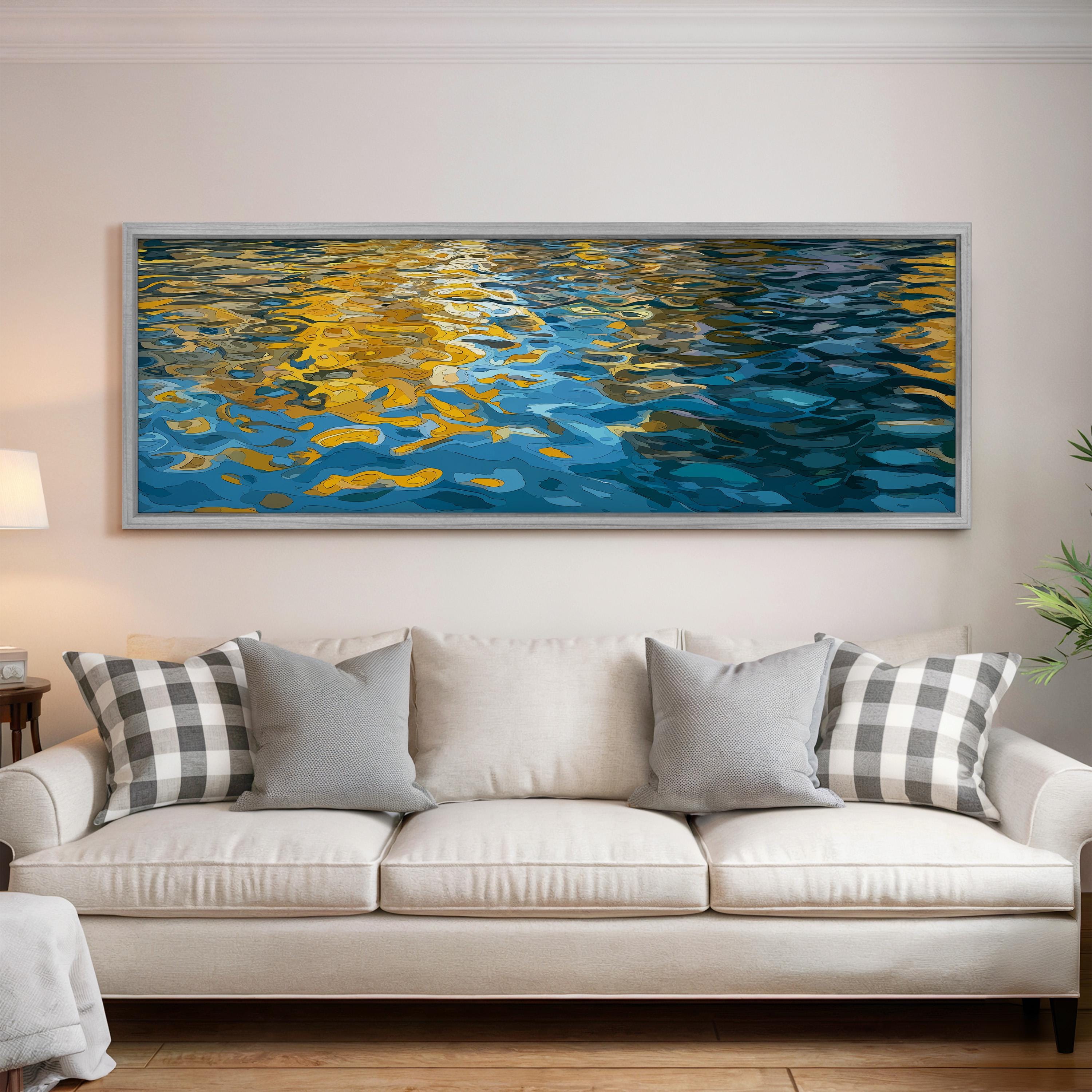 a large, framed painting of a serene water scene hanging on a wall above a white couch with gray and white patterned pillows.
