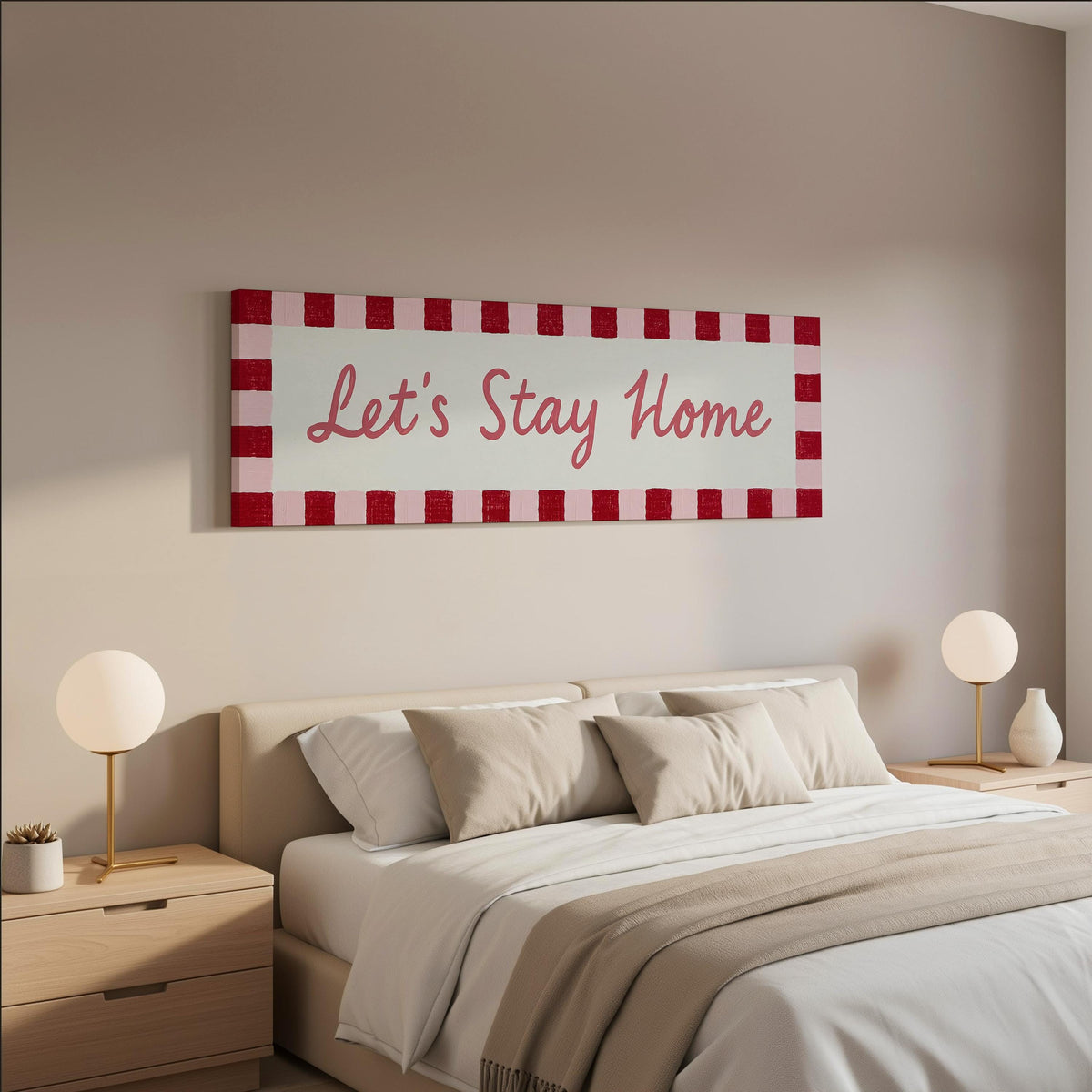 Let's stay home sign with a red checked border wide panoramic canvas print above a bed in a neutral bedroom