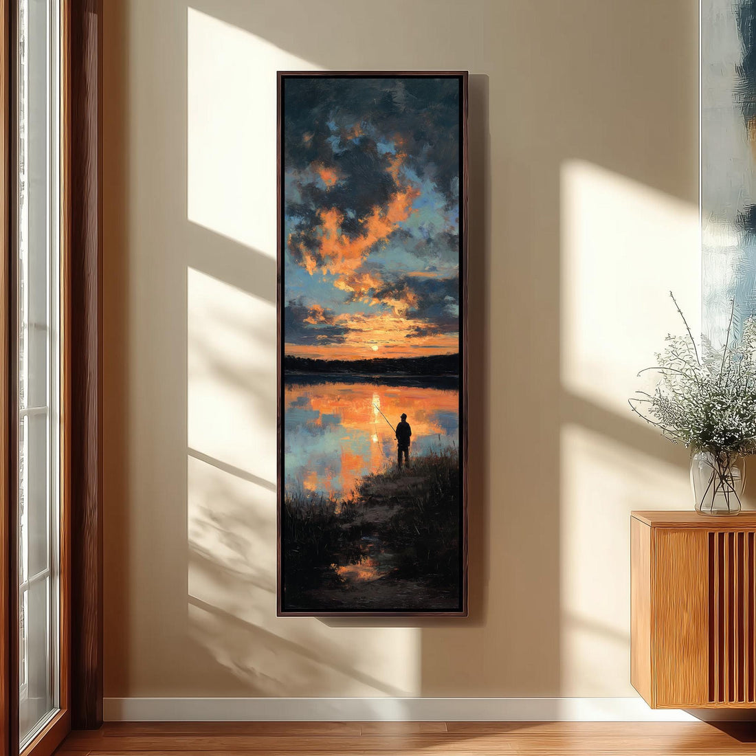 a serene indoor setting with a large painting of a sunset over a lake hanging on the wall. The painting depicts a person standing on the shore, silhouetted against the vibrant colors of the sky. The room has wooden stairs leading up to a door, and a bench is situated in the foreground. A potted plant is visible on the right side of the image.