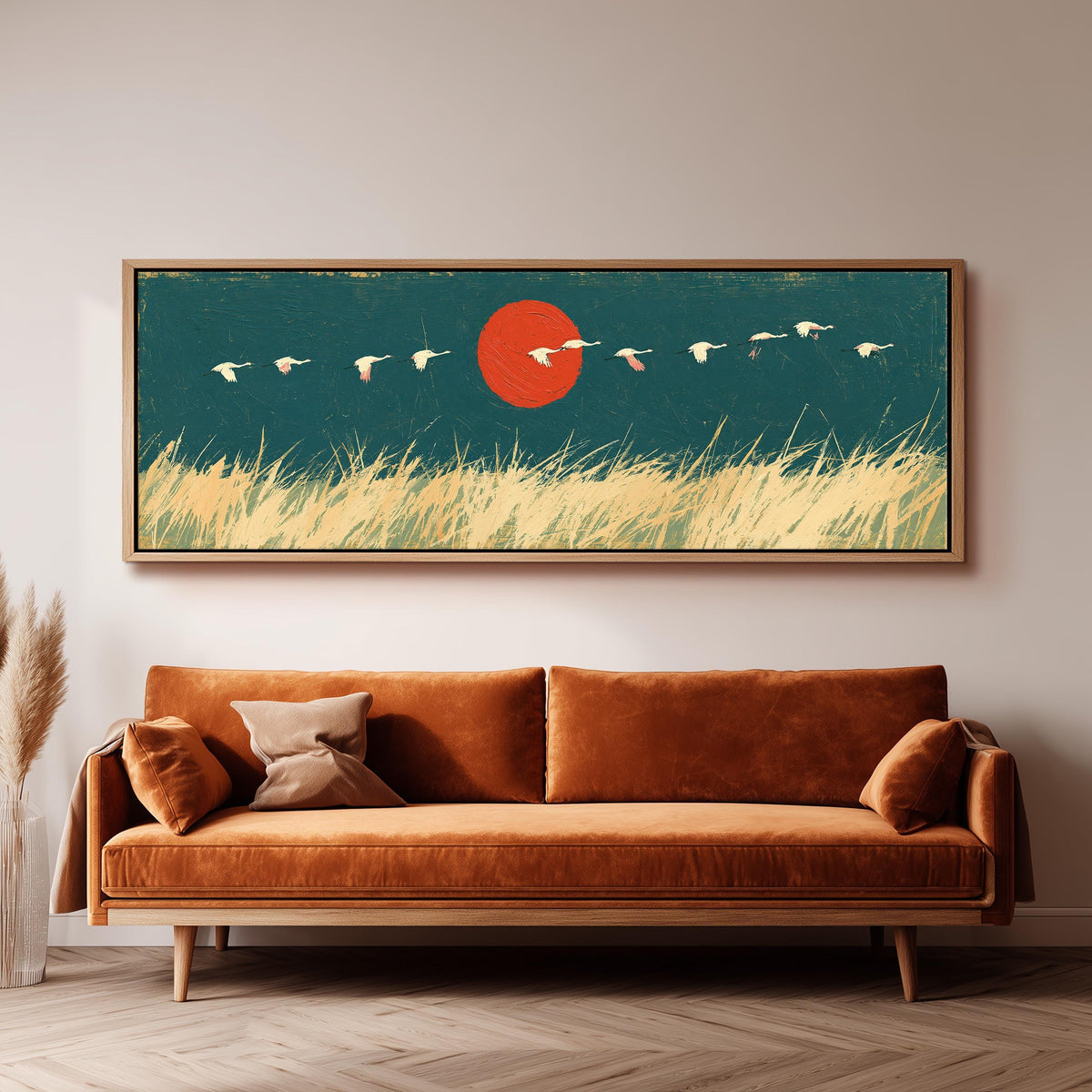 Bird flock over a prairie under a red sun wide panoramic canvas print above a bench in a dark living room