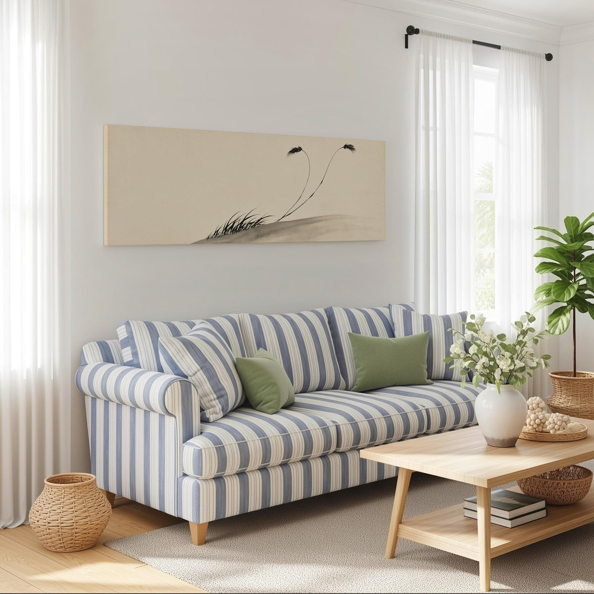 Two birds perched on bending ink reeds long horizontal canvas print above a striped sofa in a coastal living room