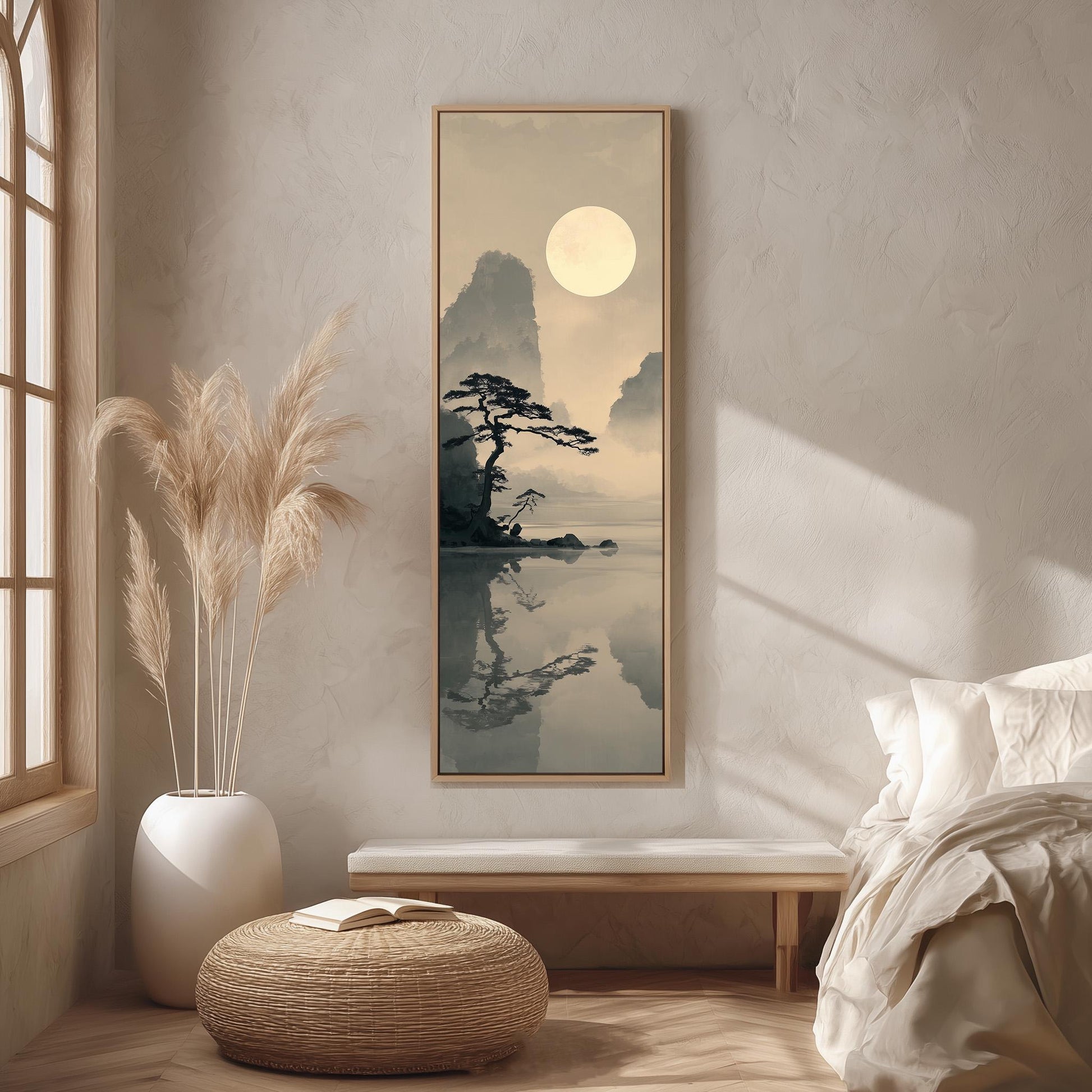 a serene bedroom scene with a large framed landscape painting hanging on the wall, featuring a tranquil lake and a tree reflected in the water. The room is decorated with a large window, a white vase with tall reeds, and a wooden bench.