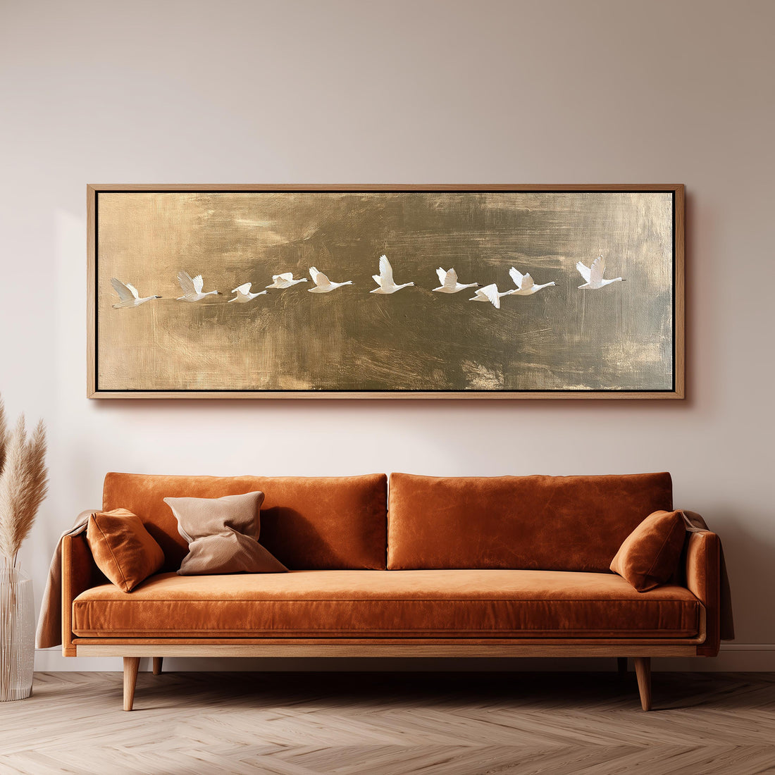 Flying geese over a gold background long horizontal canvas print above a sofa in a living room