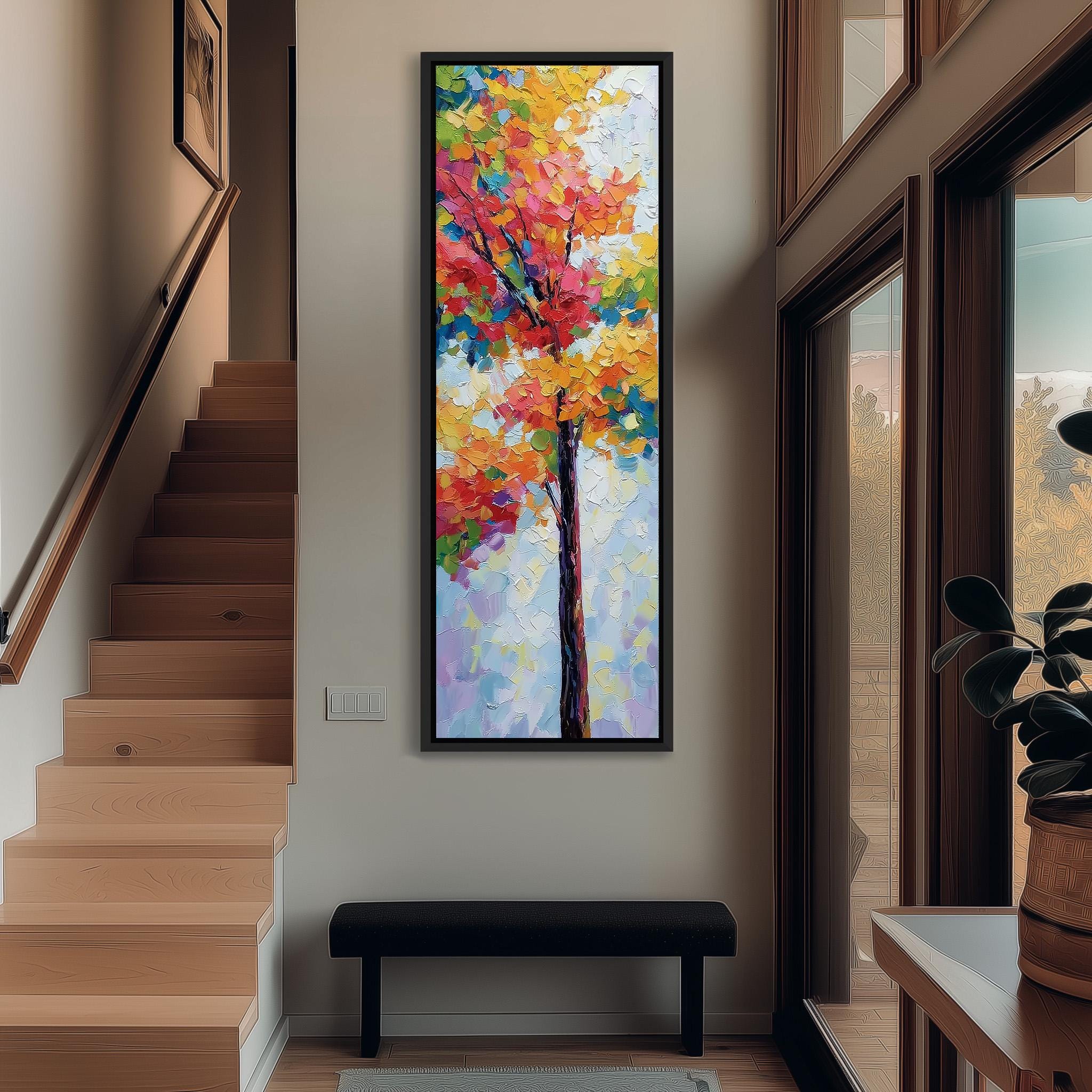 a large, colorful painting of a tree hanging on the wall of a hallway. The painting is framed and appears to be the focal point of the space. The hallway has a wooden staircase leading up to the painting, and there is a bench in the foreground. The overall atmosphere of the image is bright and inviting, with the vibrant colors of the painting adding a lively touch to the space.