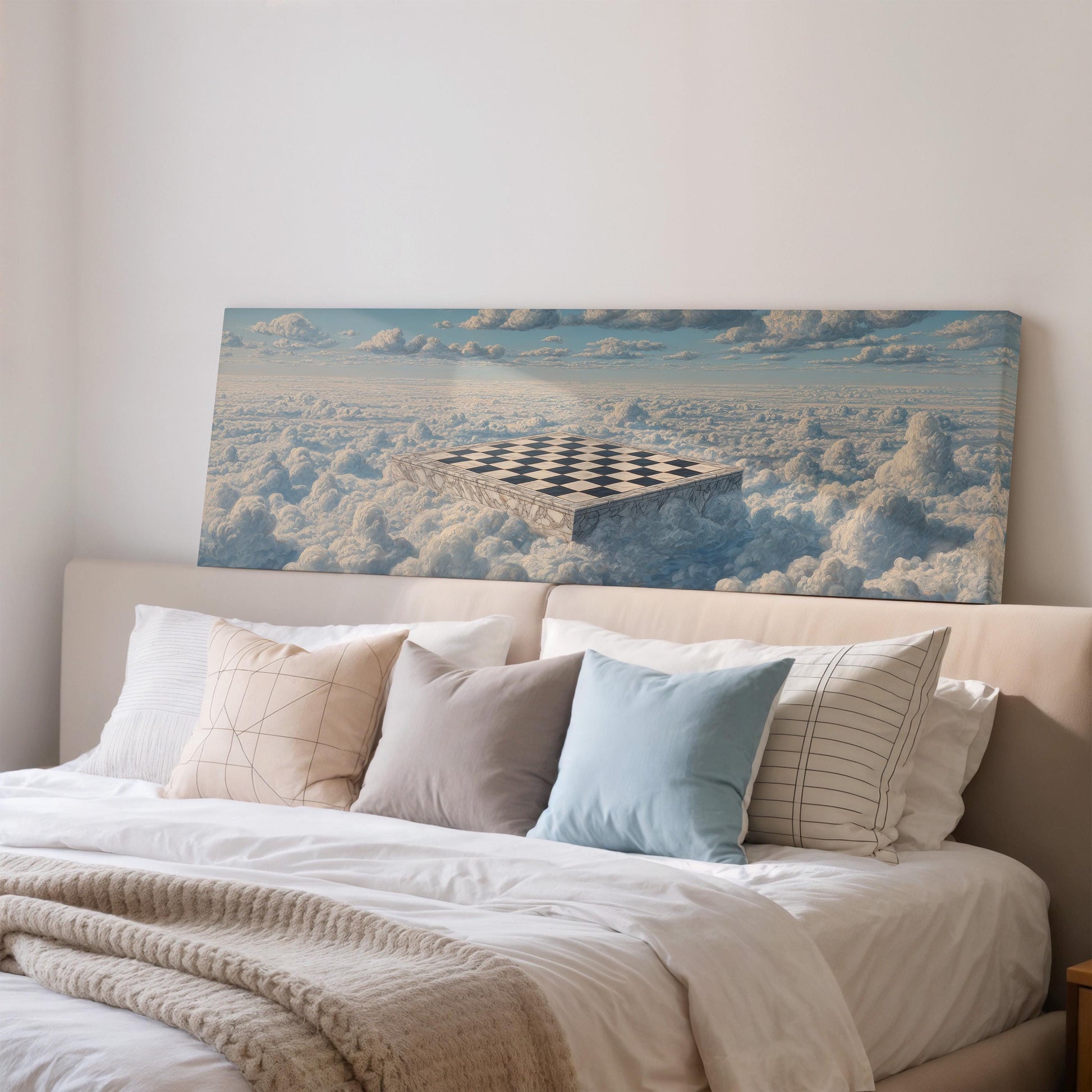 a large canvas print of a surreal landscape with a checkerboard pattern on a cloud-filled sky, mounted on a wall above a bed with white bedding and pillows.
