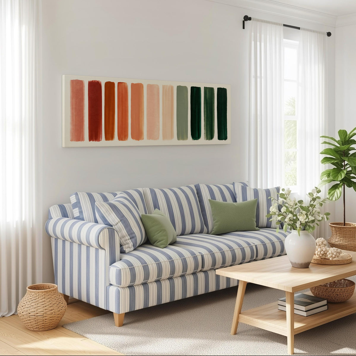 Brushed swatches from terracotta to forest green long horizontal canvas print above a striped sofa in a coastal living room
