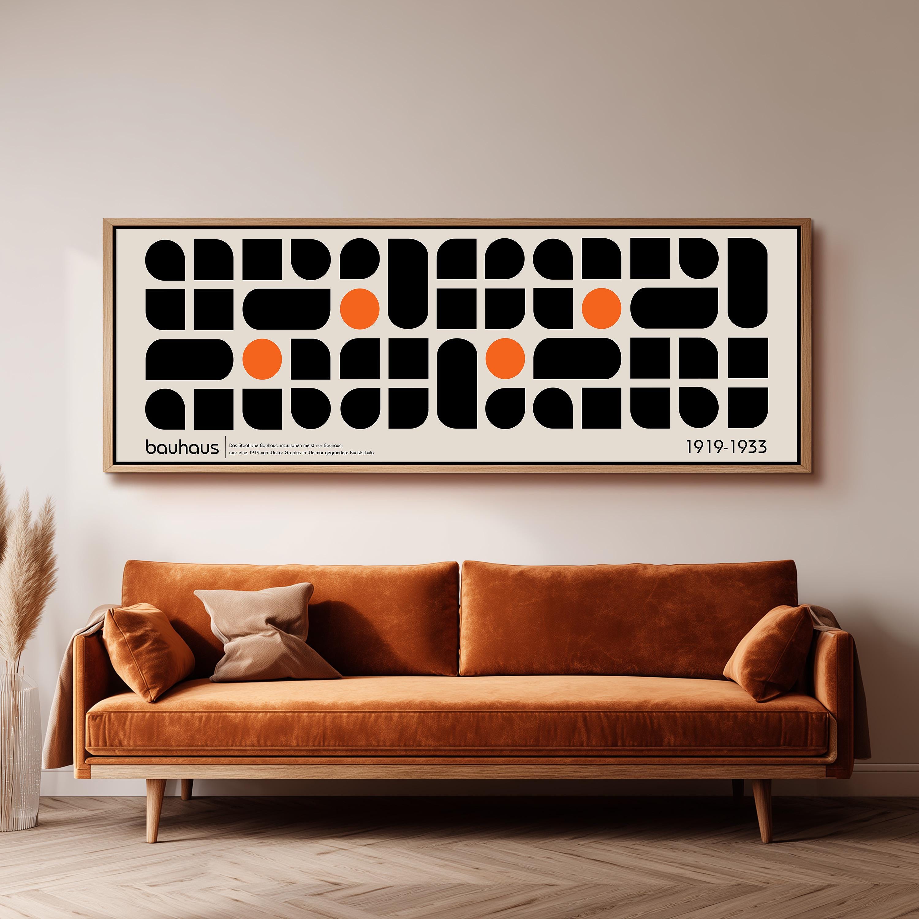 a large abstract art piece hanging on a wall above a brown sofa in a living room setting.