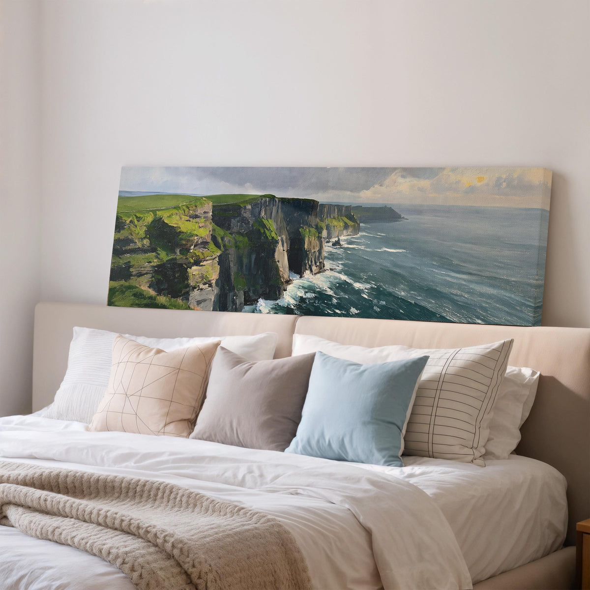 Emerald sea cliffs wide panoramic canvas print above a bed in a bedroom
